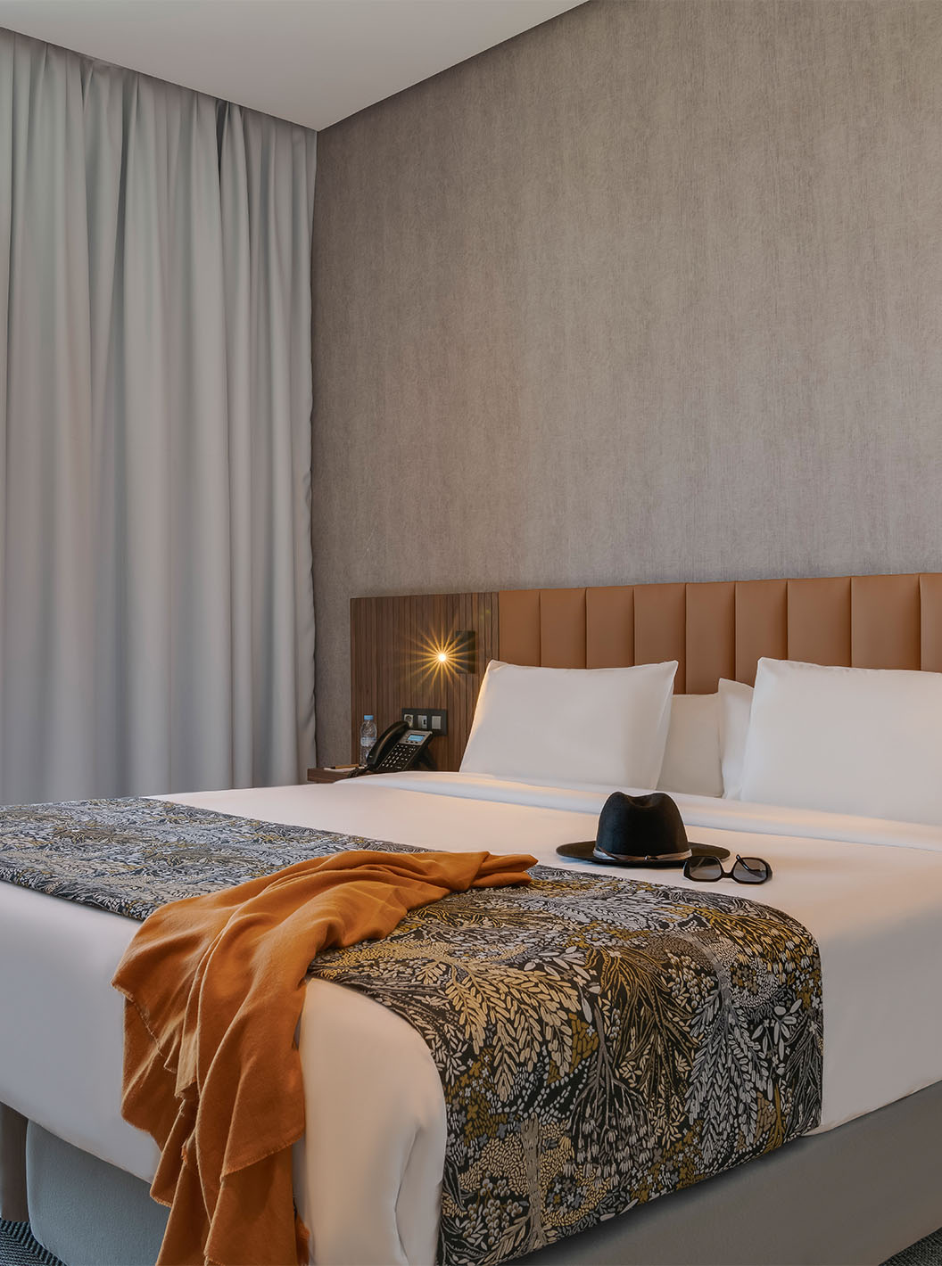 The Premium Suite at Pestana Casablanca has a bedroom with a double bed and a balcony