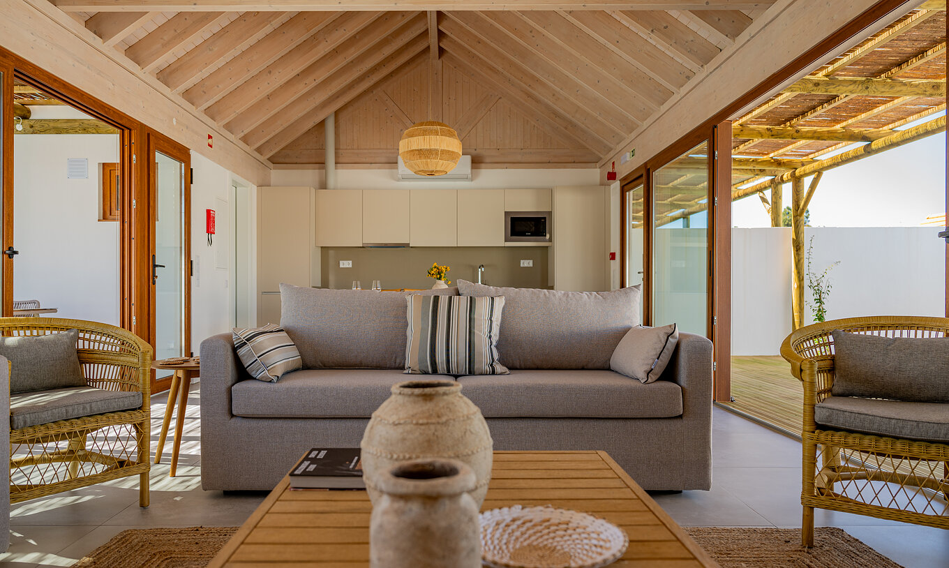 The Premium Green Villa at Pestana Comporta Village Residences has a bright living room with a sofa and decor