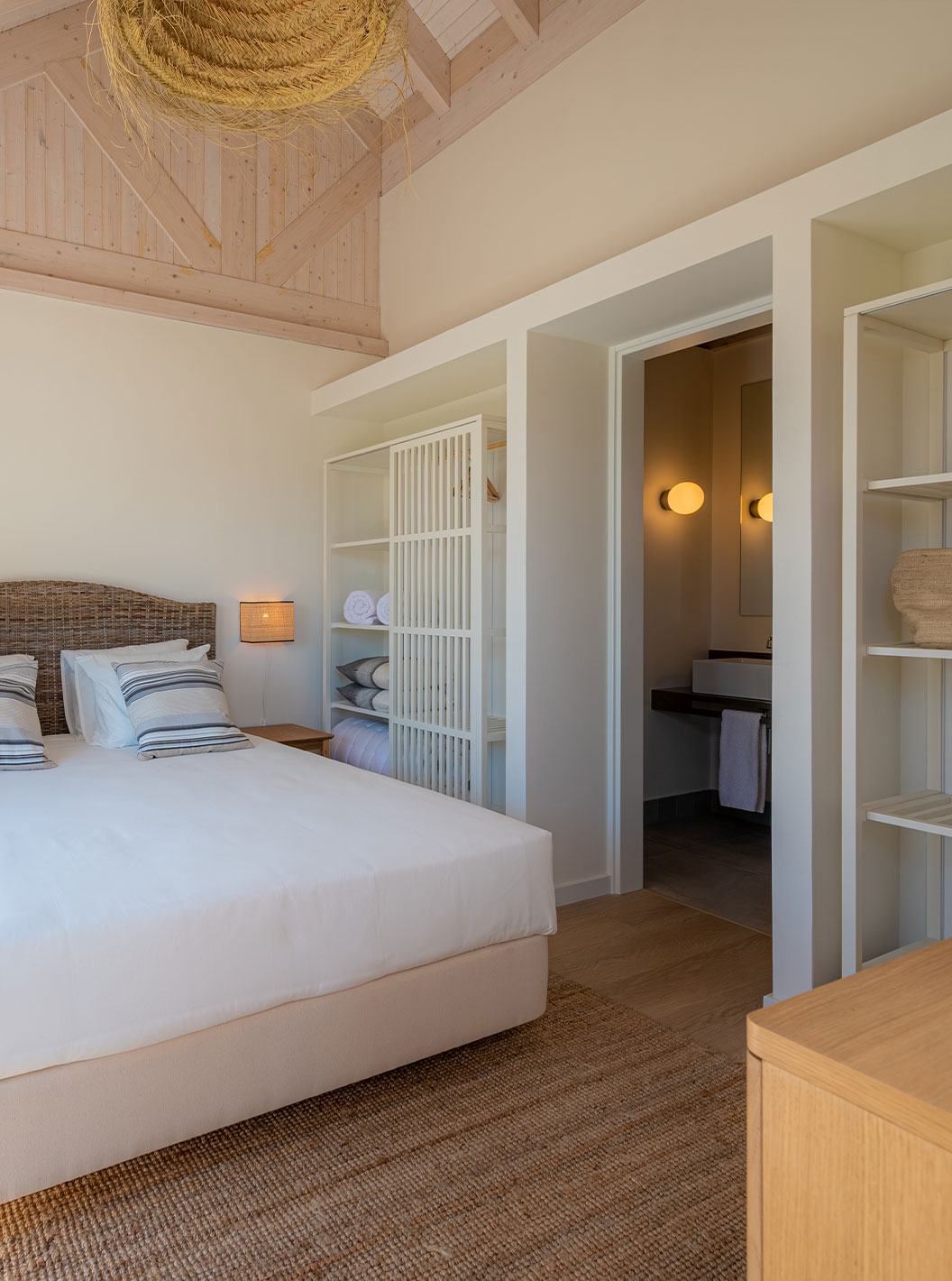 The Standard Green Villa at Pestana Comporta Village Residences has a bedroom with a double bed and simple decor