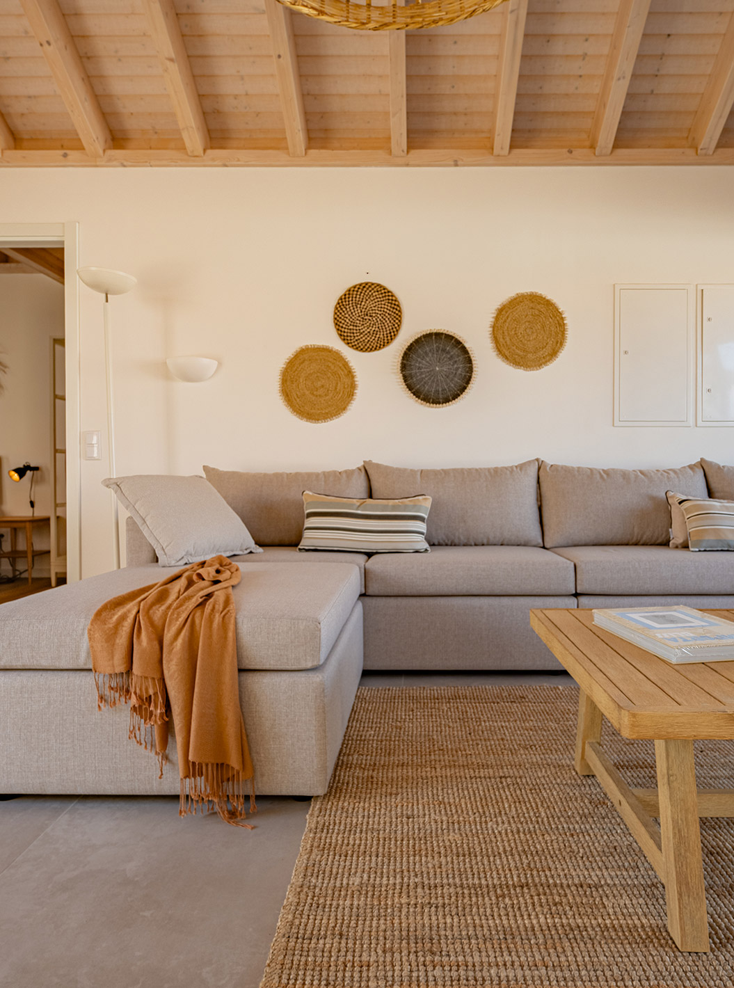 The Superior Green Villa at Pestana Comporta Village Residences has a living room with a gray sofa and a table