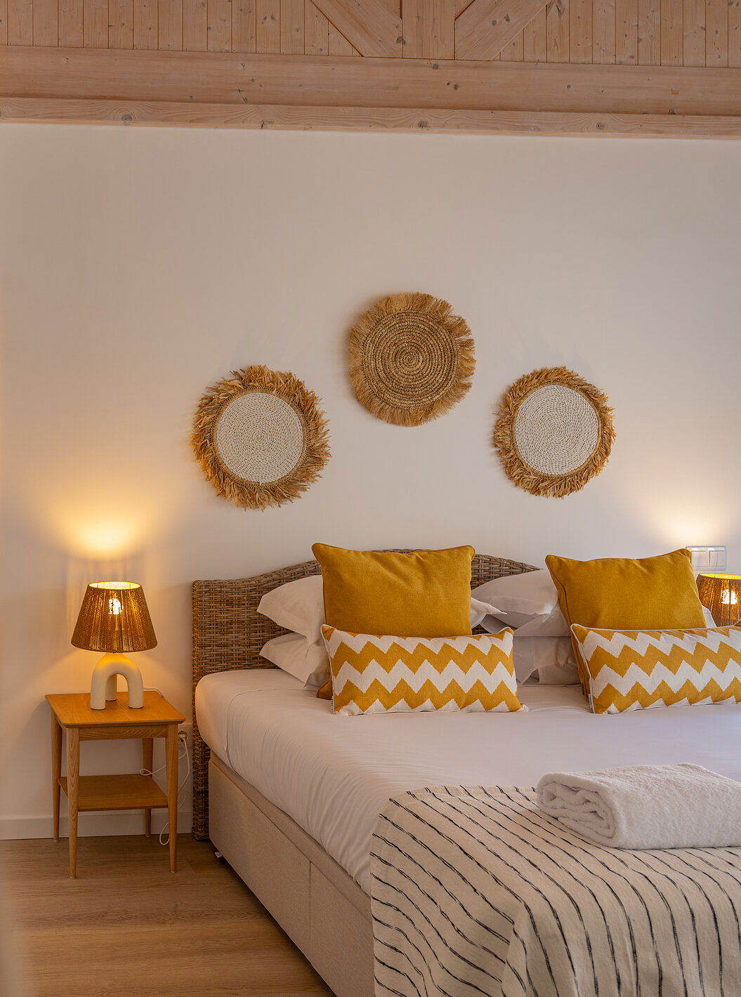 The Superior Villa at Pestana Comporta Village Residences has a bedroom with a double bed and yellow pillows