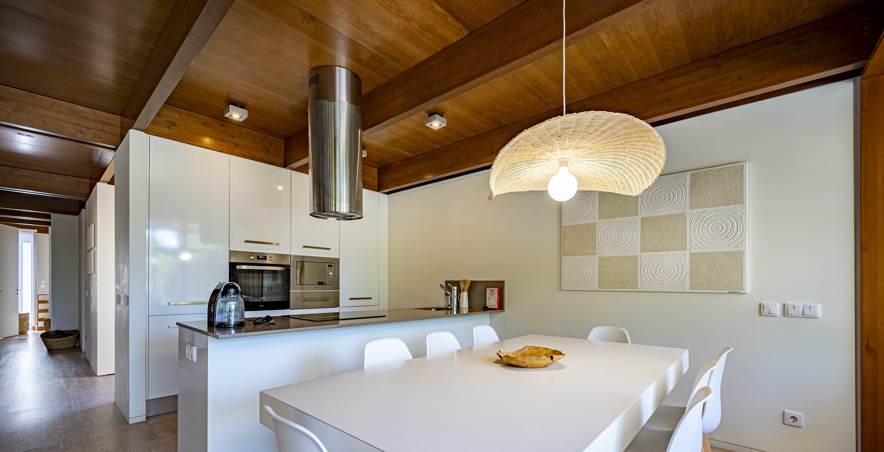 The Tree Villa with Private Pool of Pestana Tróia Eco Resort has an equipped kitchen and a table with chairs beside