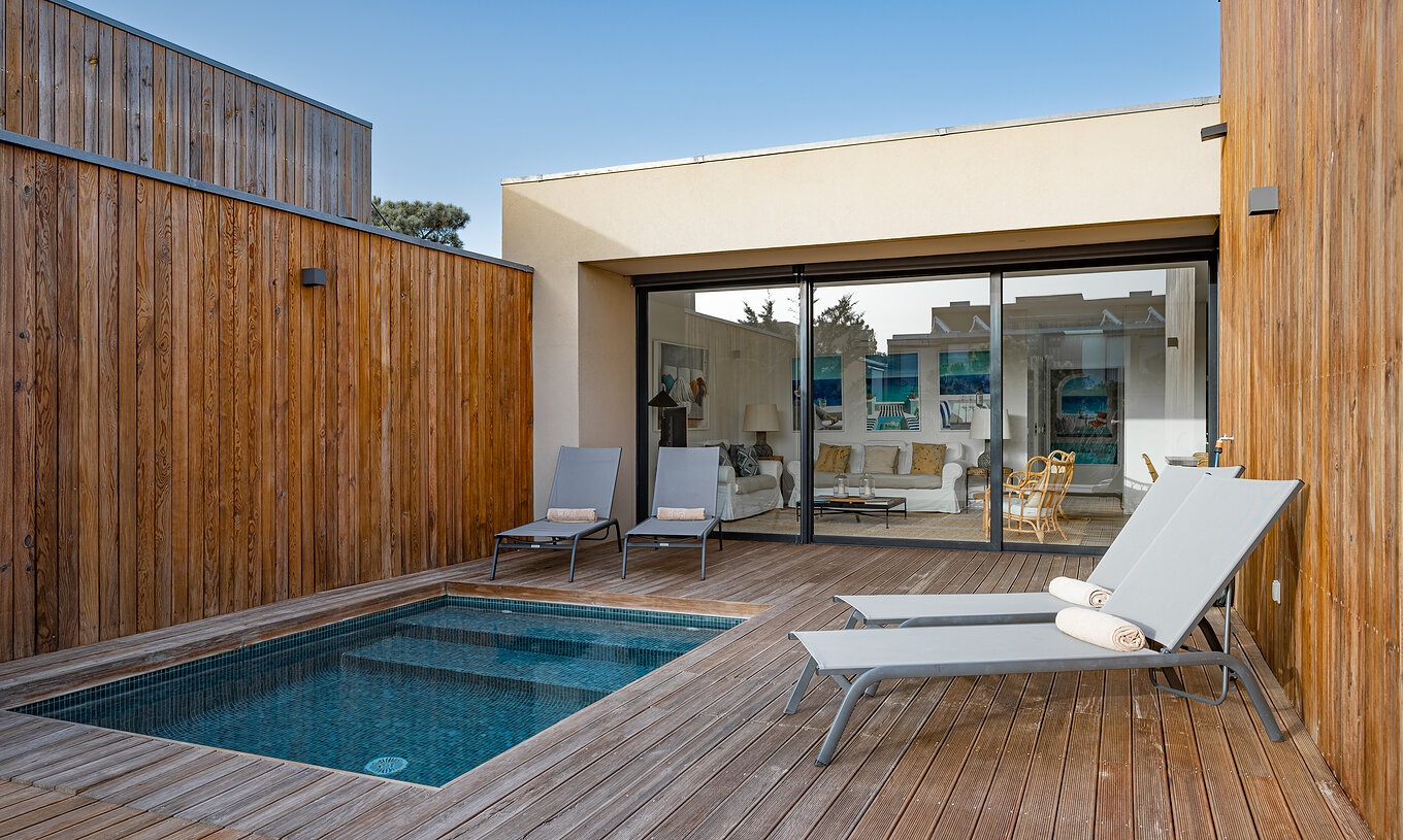 The Pine Villas of Pestana Tróia Eco Resort have a private pool and two sun loungers