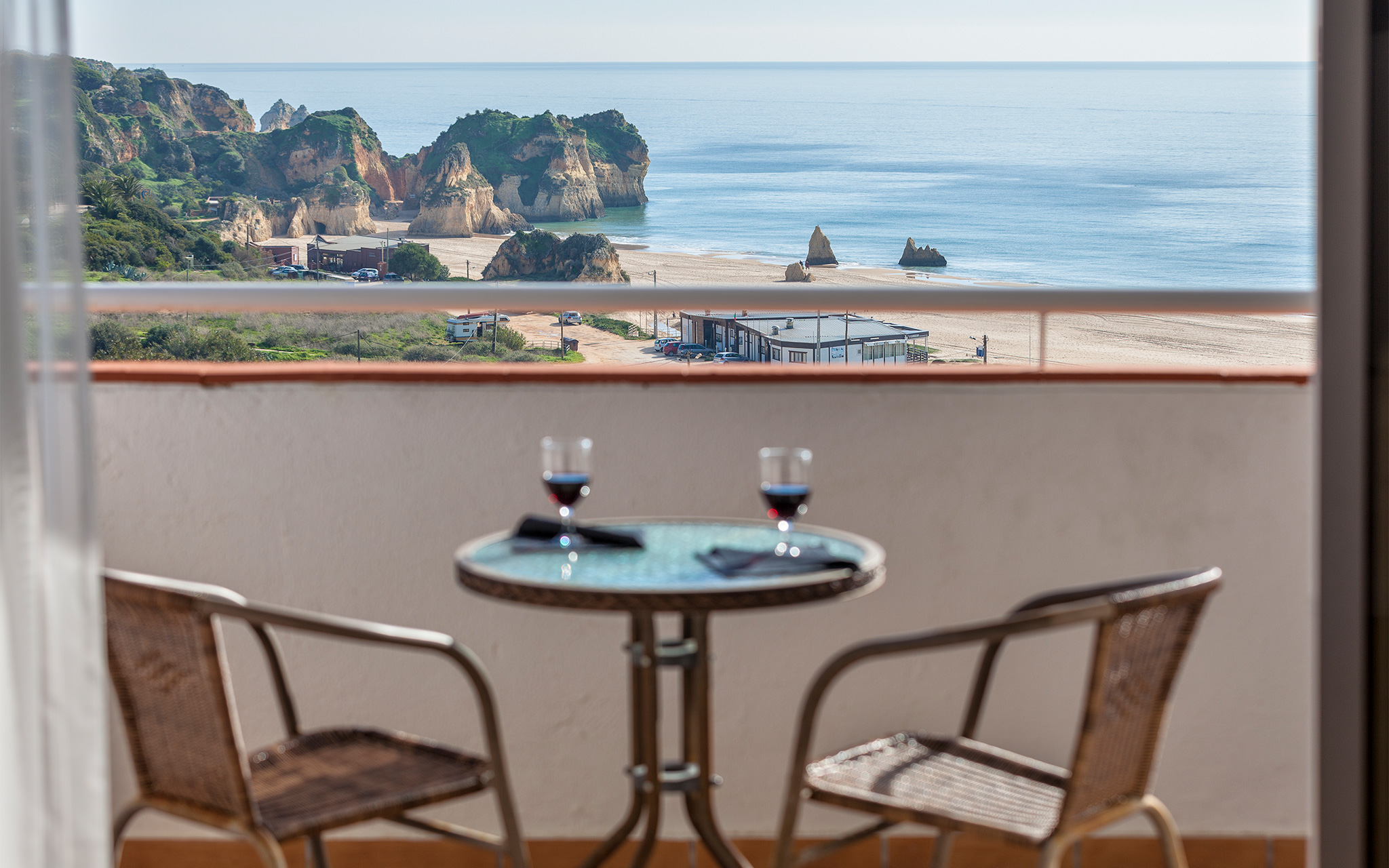 Table on a balcony with a beach view at Pestana Alvor Atlântico apartments