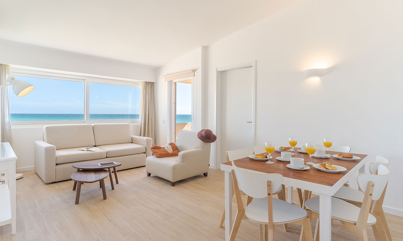 The 3 Bedroom Premium Sea View Villa at Pestana Alvor Beach Villas has a living room with sofas and a tabl