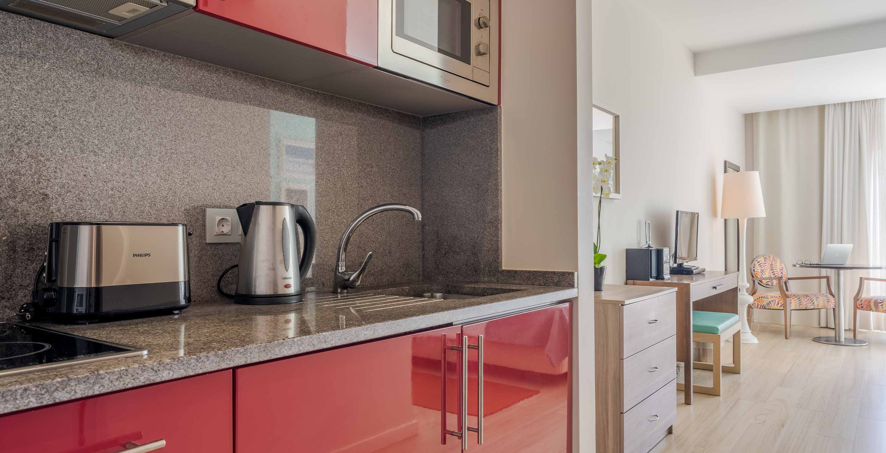 The Sea View Studio at Pestana Alvor Praia has a kitchenette with a microwave, kettle, toaster, and stove