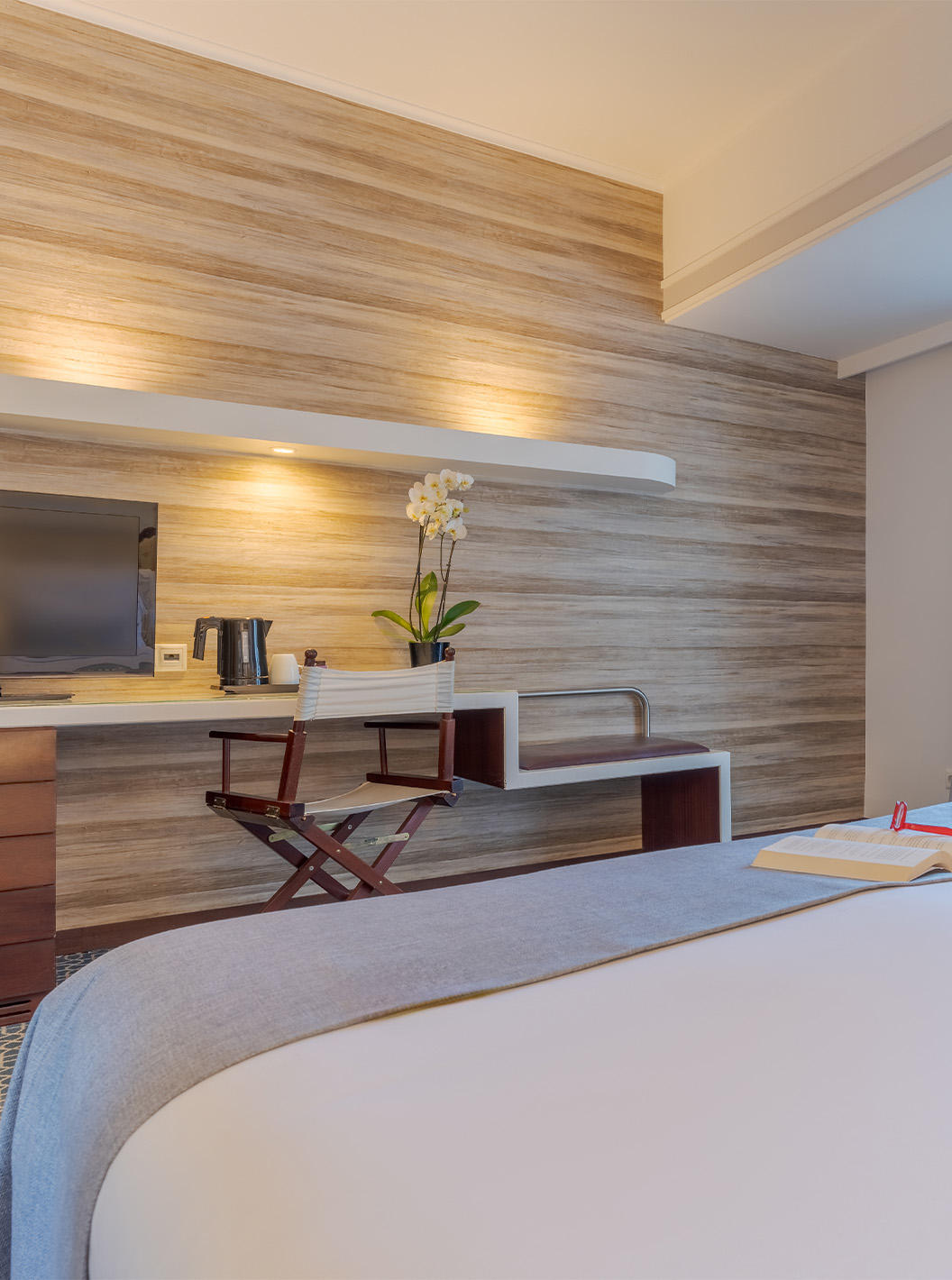 The Garden View Deluxe at Pestana Alvor Praia has a double bed, a desk TV, an armchair, and a window