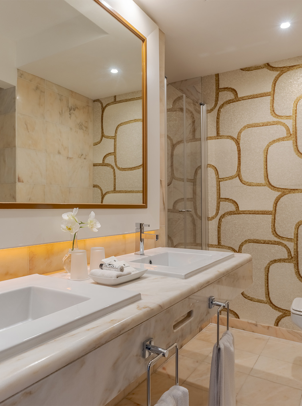 The Sea View Deluxe at Pestana Alvor Praia has a marble bathroom with two sinks, a large mirror, and toilet