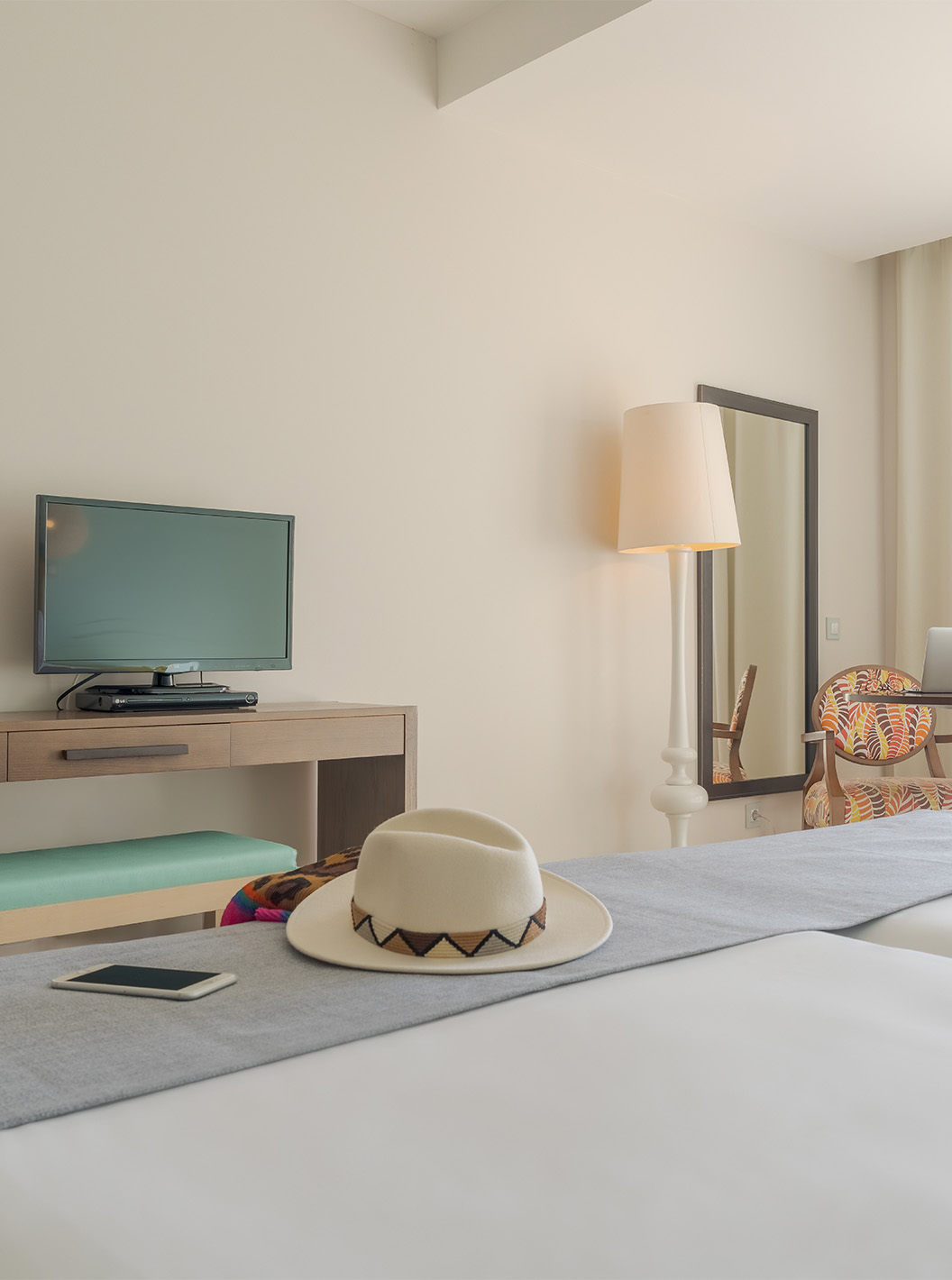 The Sea View Studio at Pestana Alvor Praia has a desk with a TV, a wall mirror, and a window to the balcony