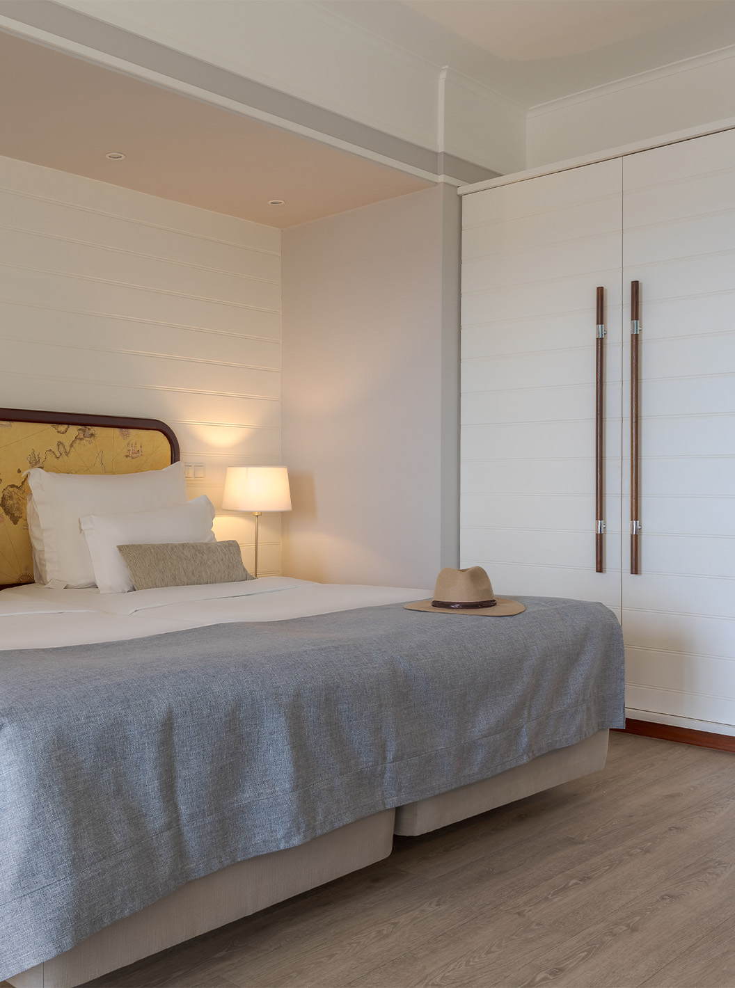 The Superior Sea View at Pestana Alvor Praia has two joined beds with bedside tables and a white wardrobe