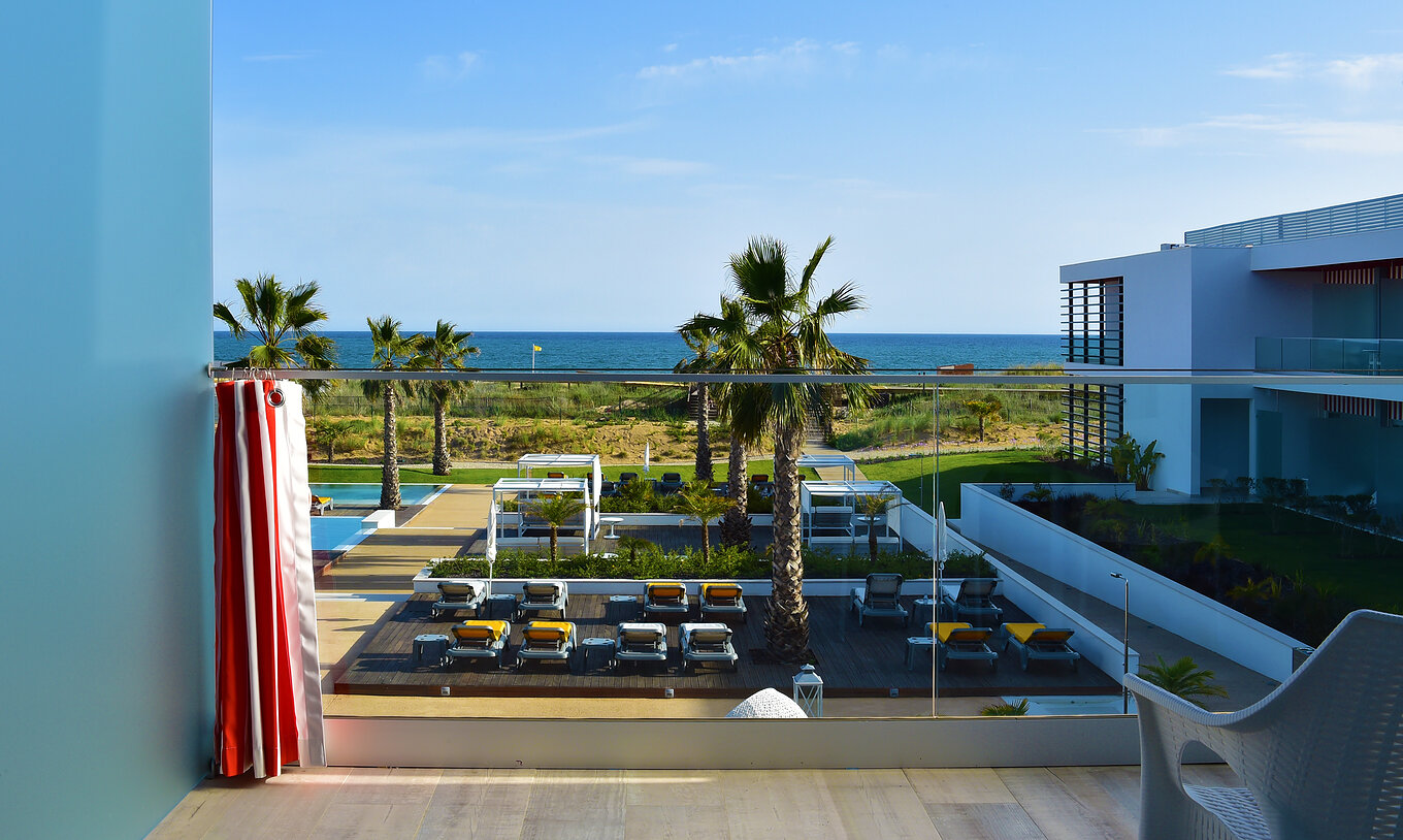 The Deluxe Balcony Sea or Pool View - Exclusive Website of Pestana Alvor South Beach has a balcony with beach view