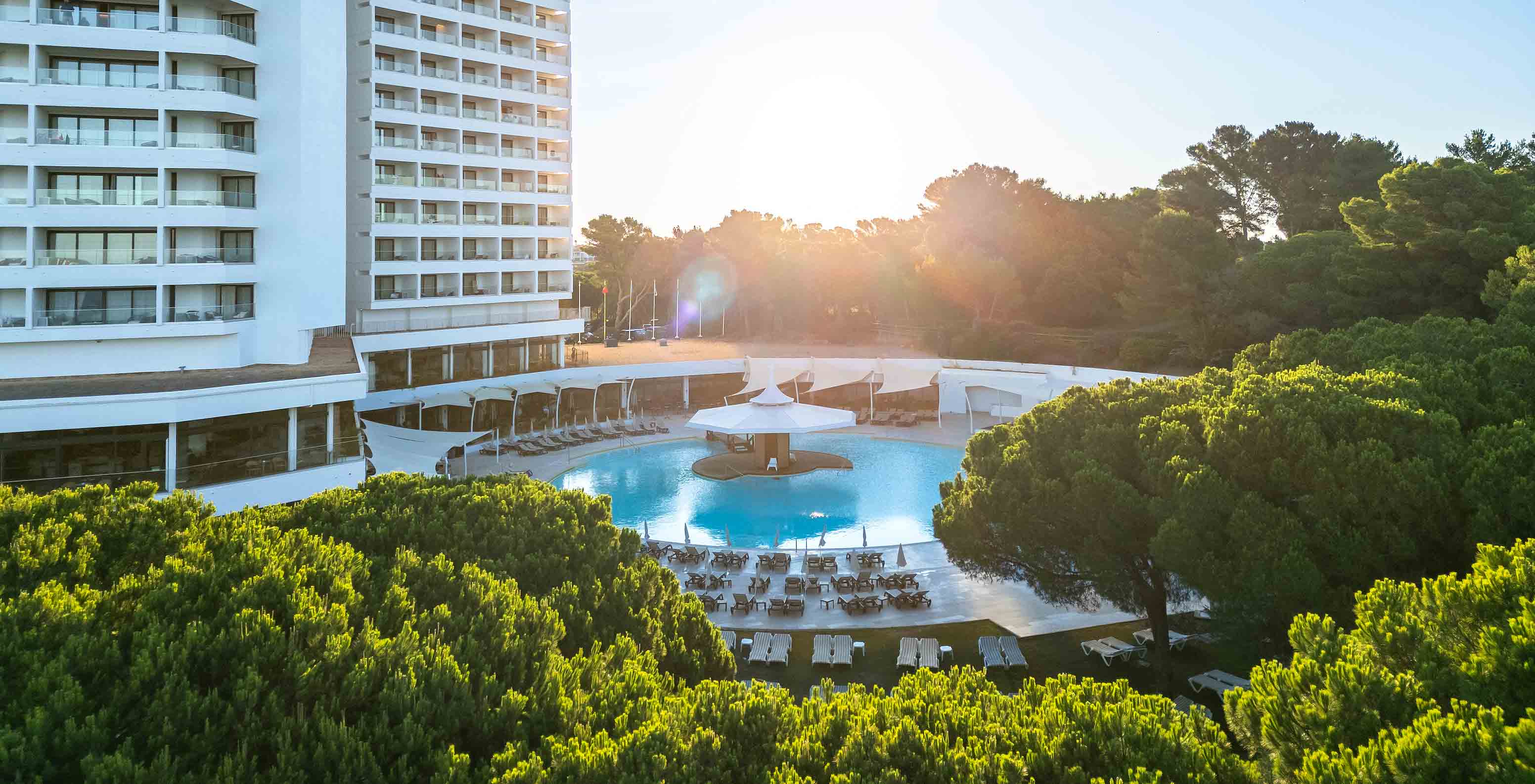Outdoor pool of Pestana Blue Alvor Beach, a 5-star hotel near the beach, with several sun loungers