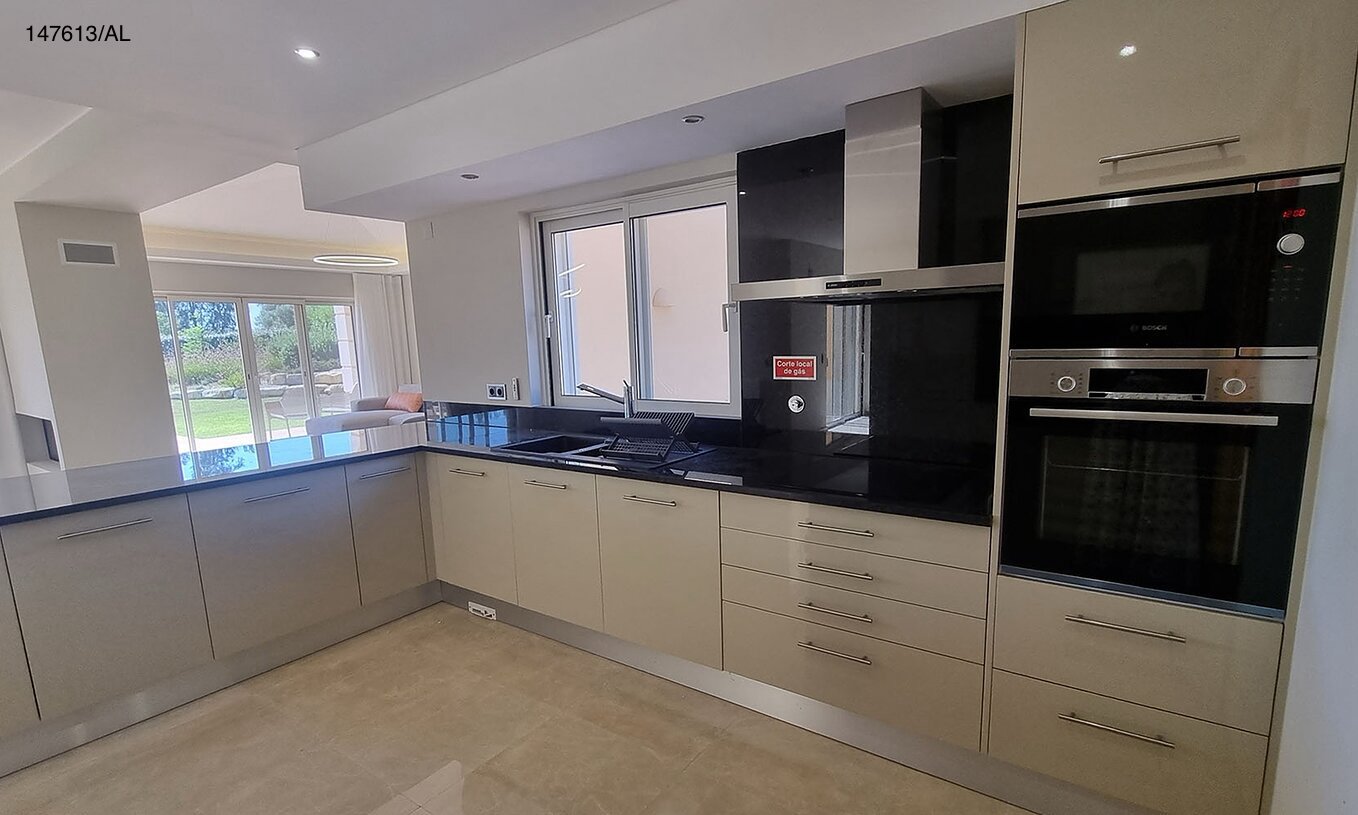 The Pestana Carvoeiro Golf V5 Superior Villa has a modern kitchen equipped with appliances