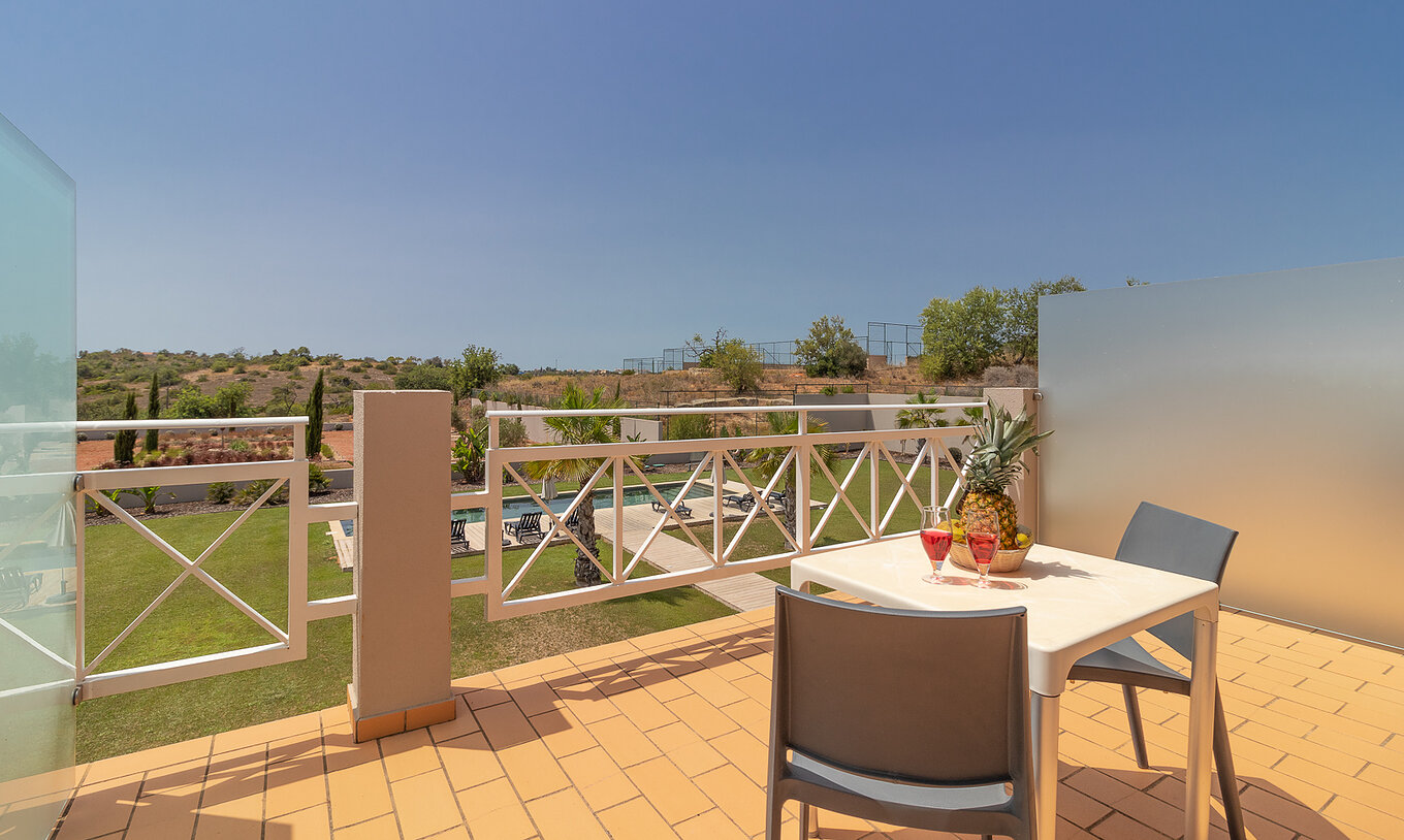 Classic Room with balcony, pool and garden view at Pestana Gramacho Residences