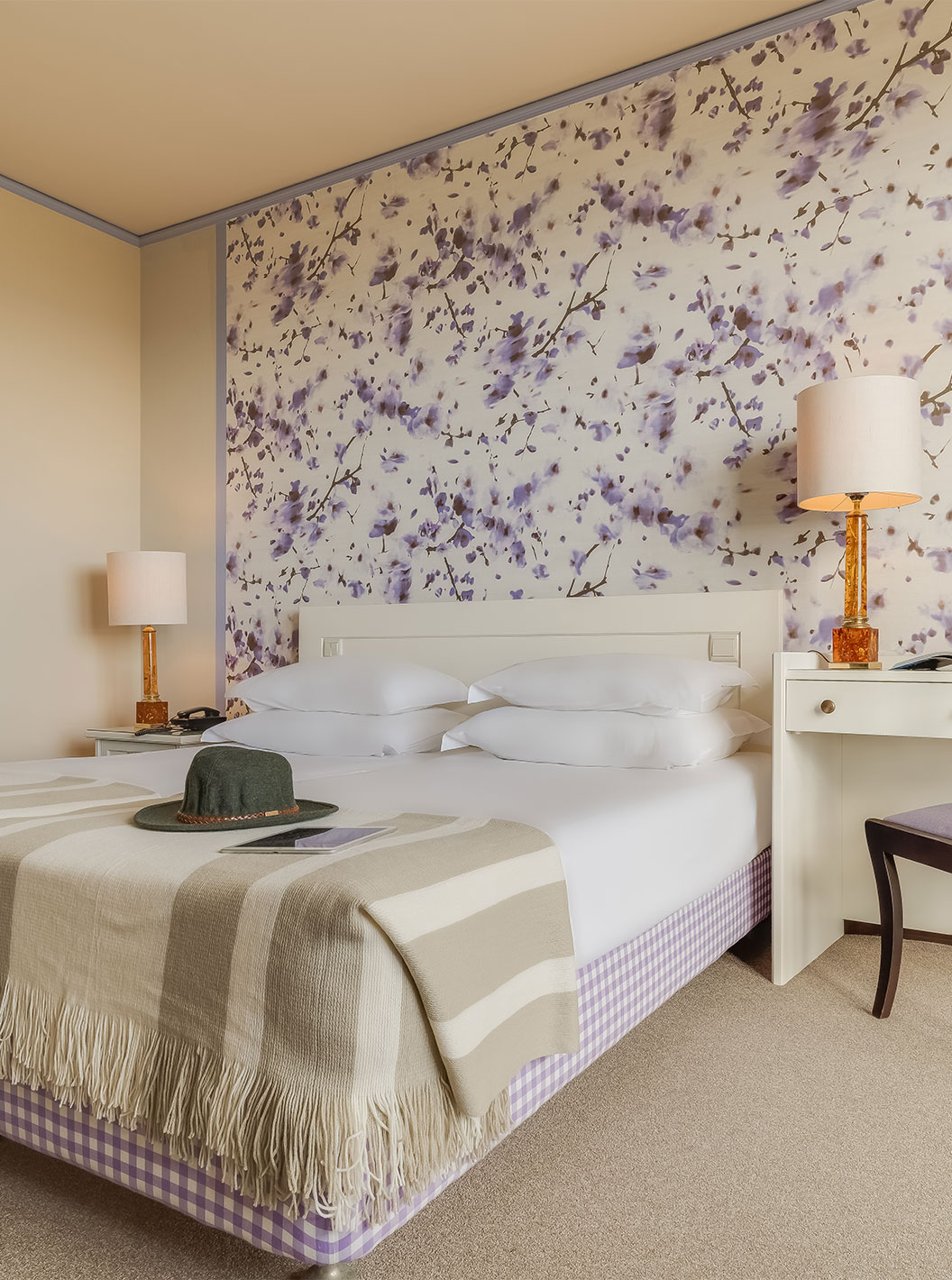 Standard Garden View room at Pestana Bahia Praia has a bed with 4 pillows and a desk beside the bed with a chair