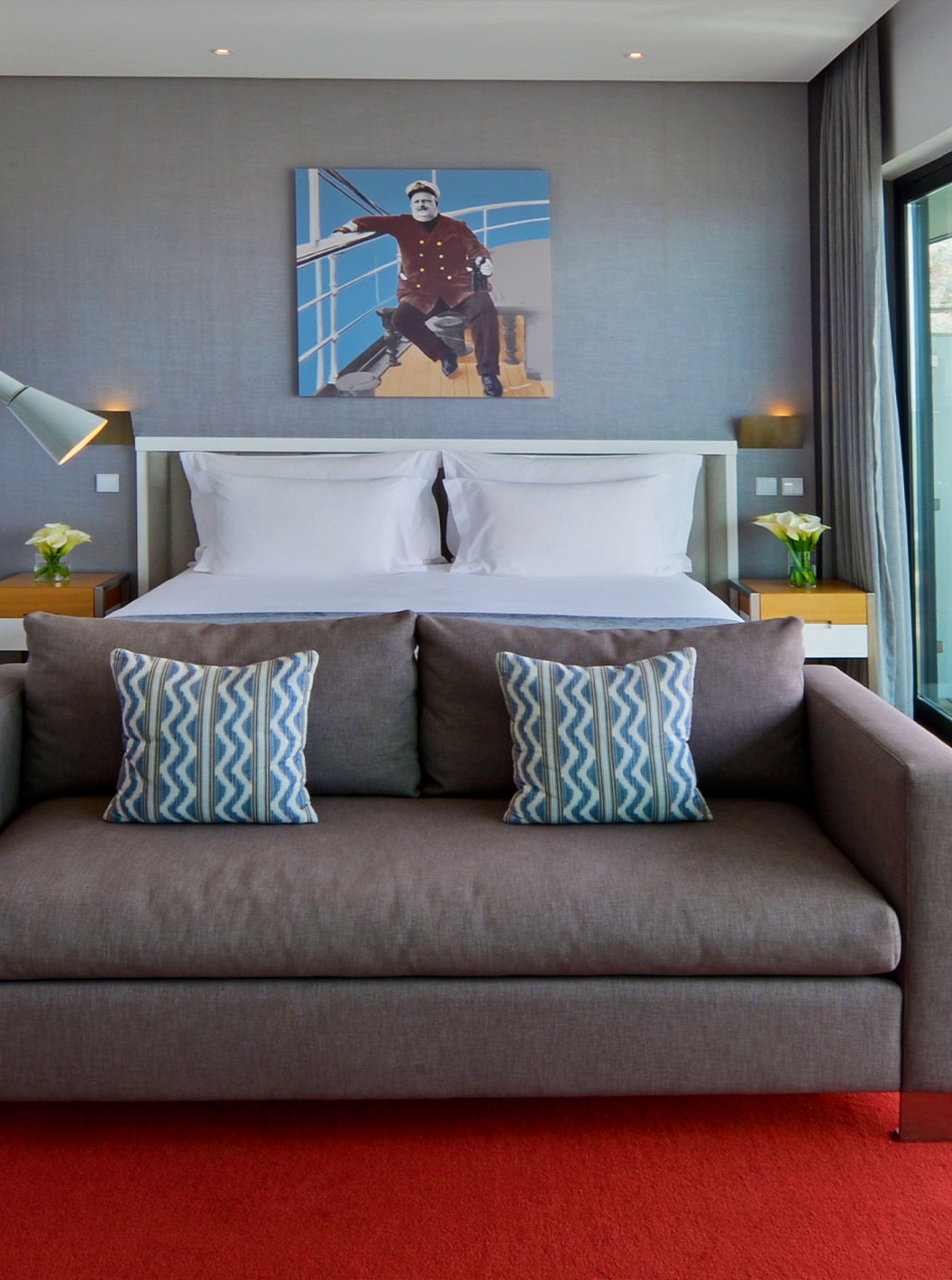 The Superior Double Room at Pestana Cidadela Cascais has a painting on the wall, a double bed, and a comfortable sofa