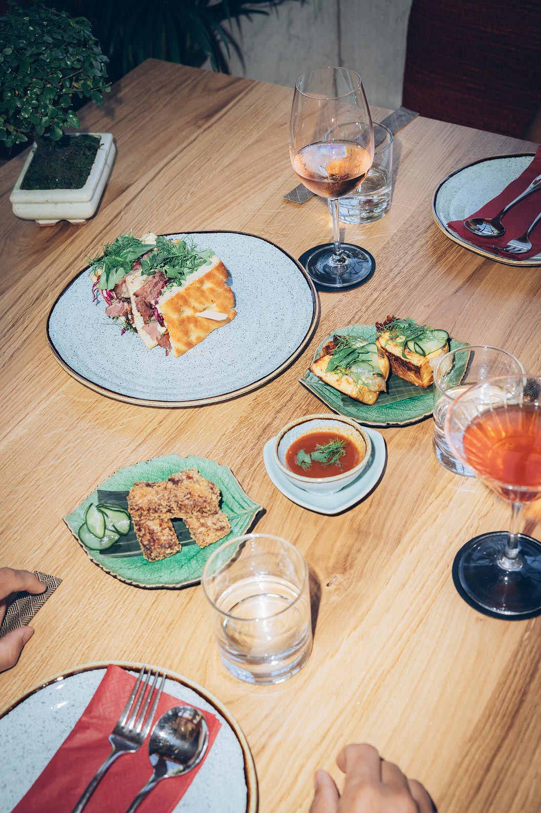 Casa do Lago by SOI 5 Star Hotel National Monument has a wooden table with tasty snacks