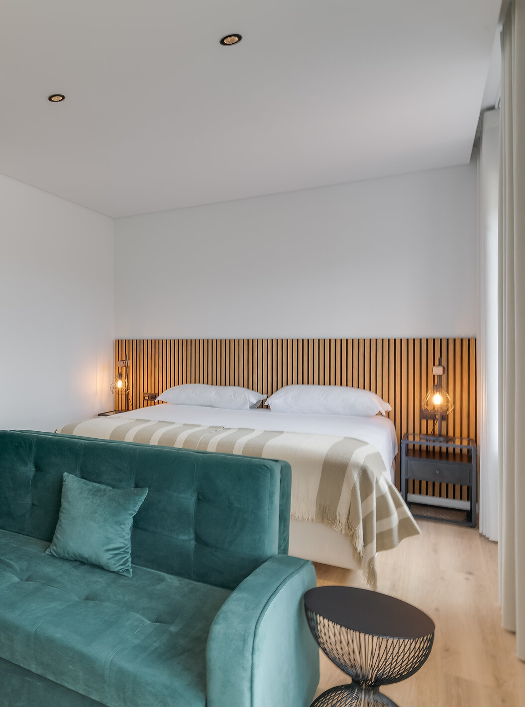 The Family with Balcony - Clubhouse of Pestana Sintra Golf has a double bed with wooden headboard, a sofa, and a table