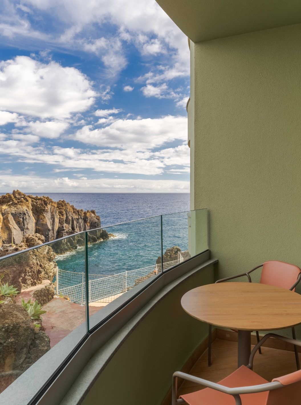 The Superior Side Sea View at the Pestana Vila Lido Madeira has a balcony with table and chairs