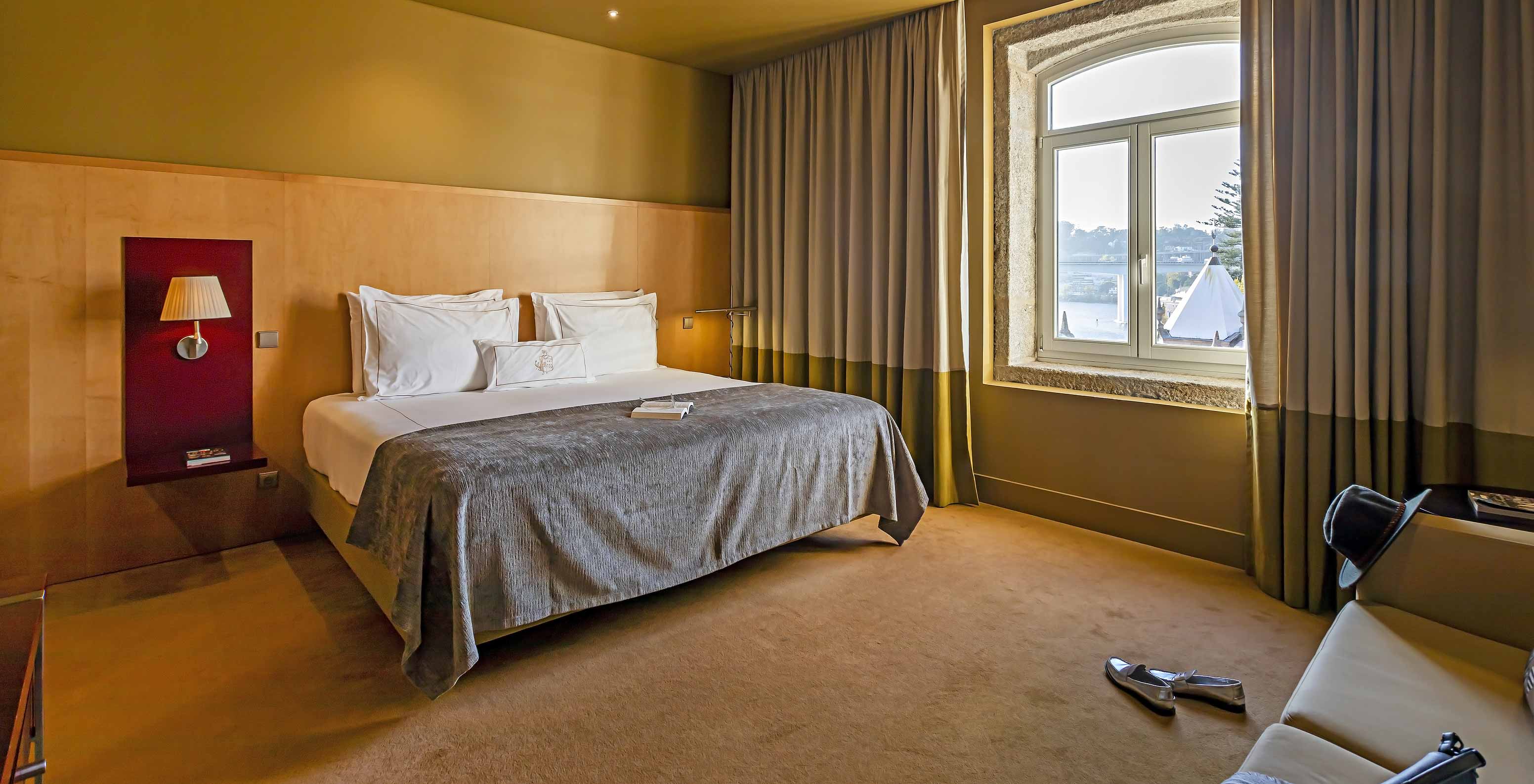 The Executive has a double bed with a window overlooking the Douro River