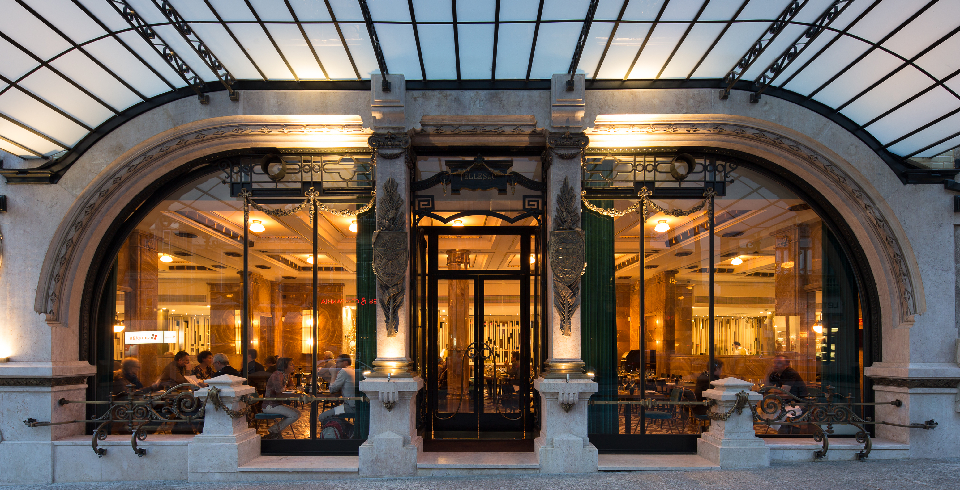 Historic glass entrance with classical architecture at the restaurant of Pestana Porto - A Brasileira