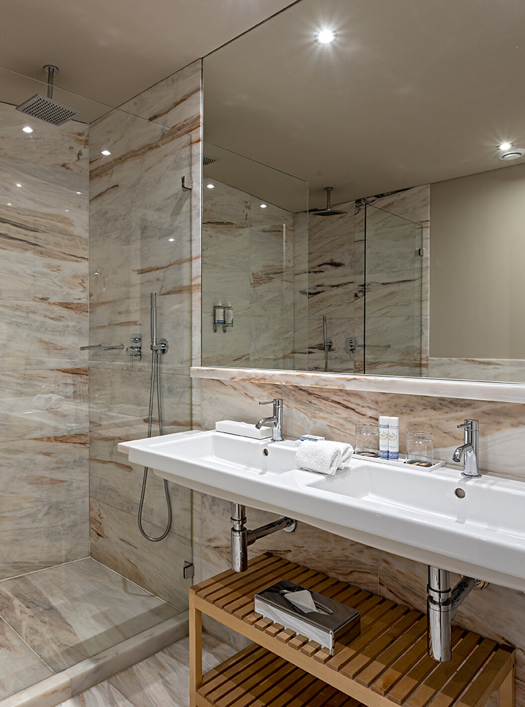 The Heritage Suite at Pestana Vintage Porto has a bathroom with marble walls, sink and shower