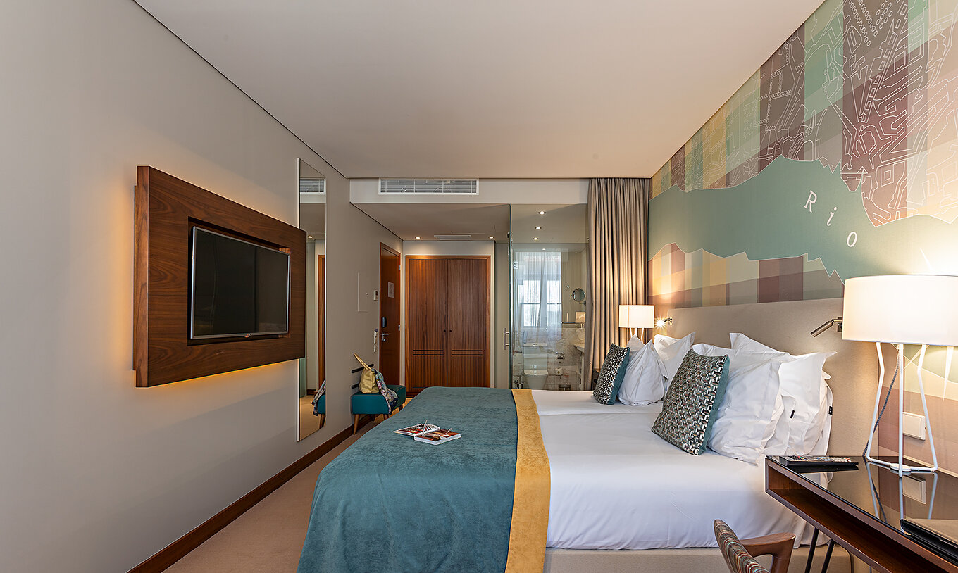 The Superior at Pestana Vintage Porto has a double bed and a television and view of the bathroom