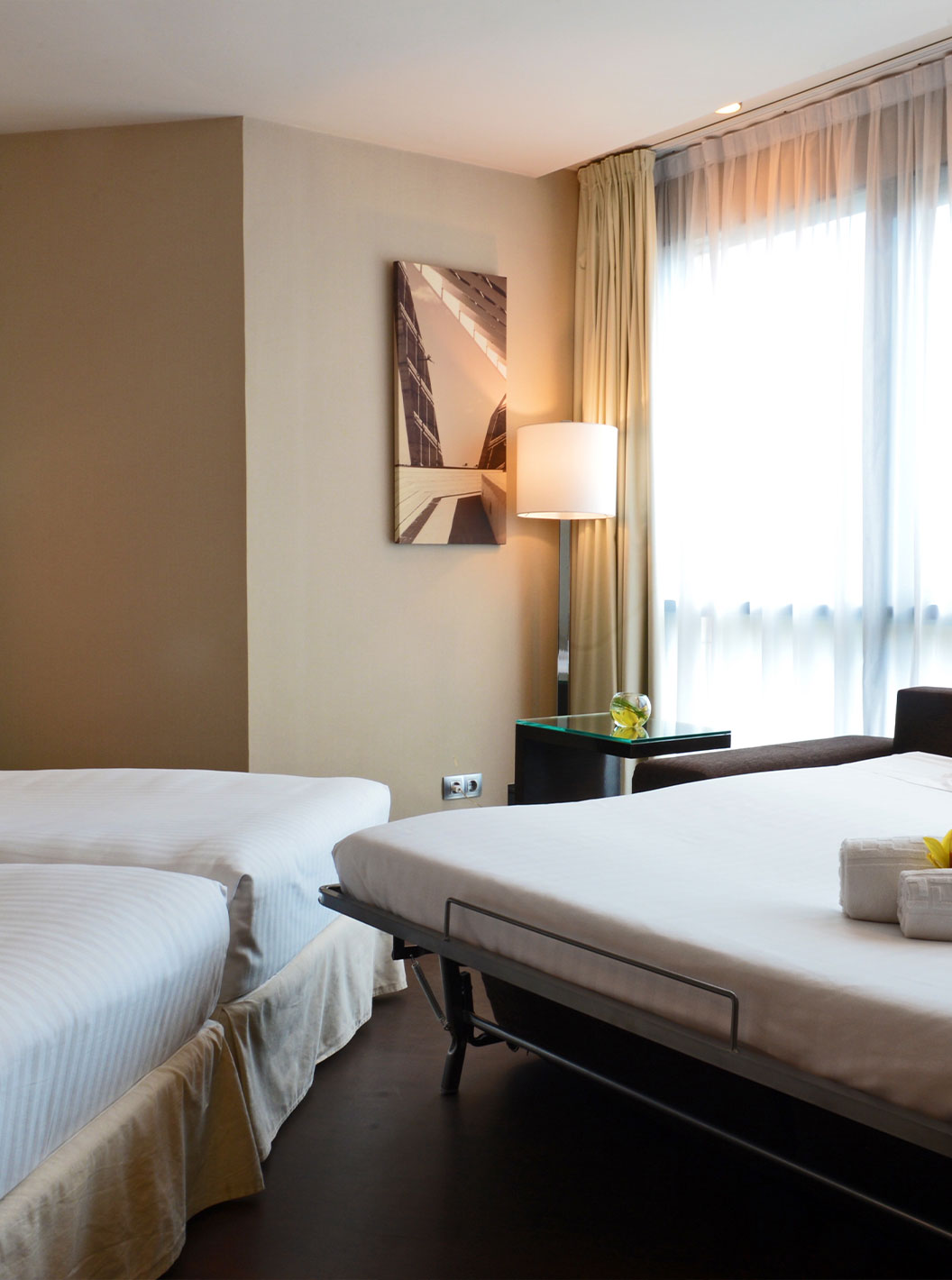 Superior Family room at Pestana Arena Barcelona can have three beds, the third being a sofa bed