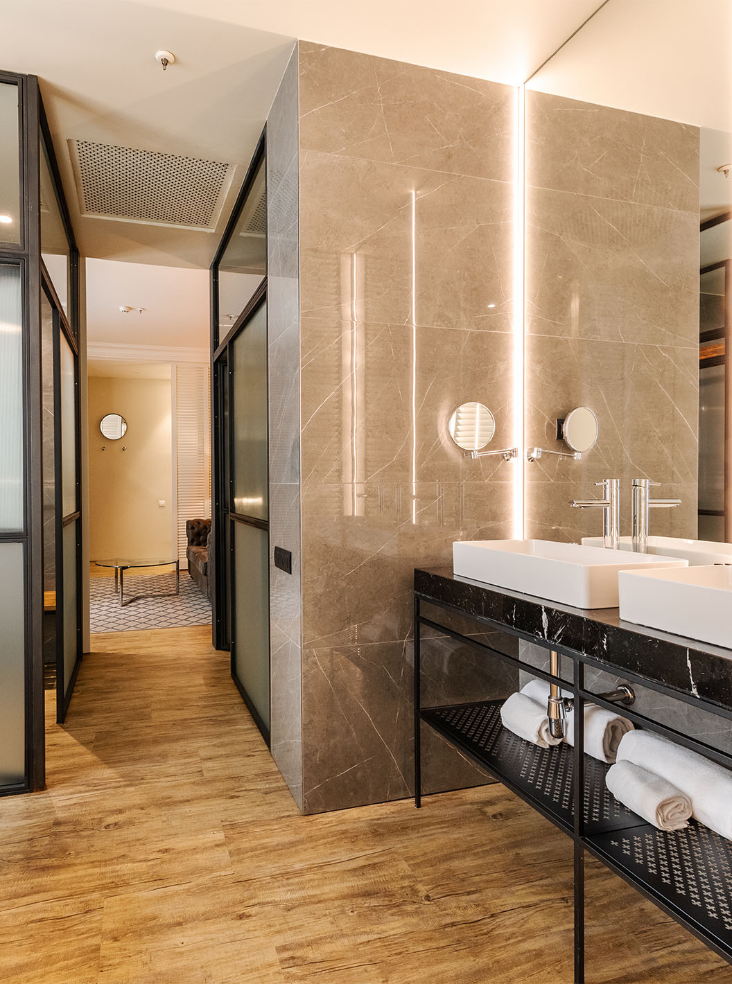 The Suite at Pestana Plaza Mayor Madrid has a large bathroom with two sinks, mirror and bathtub