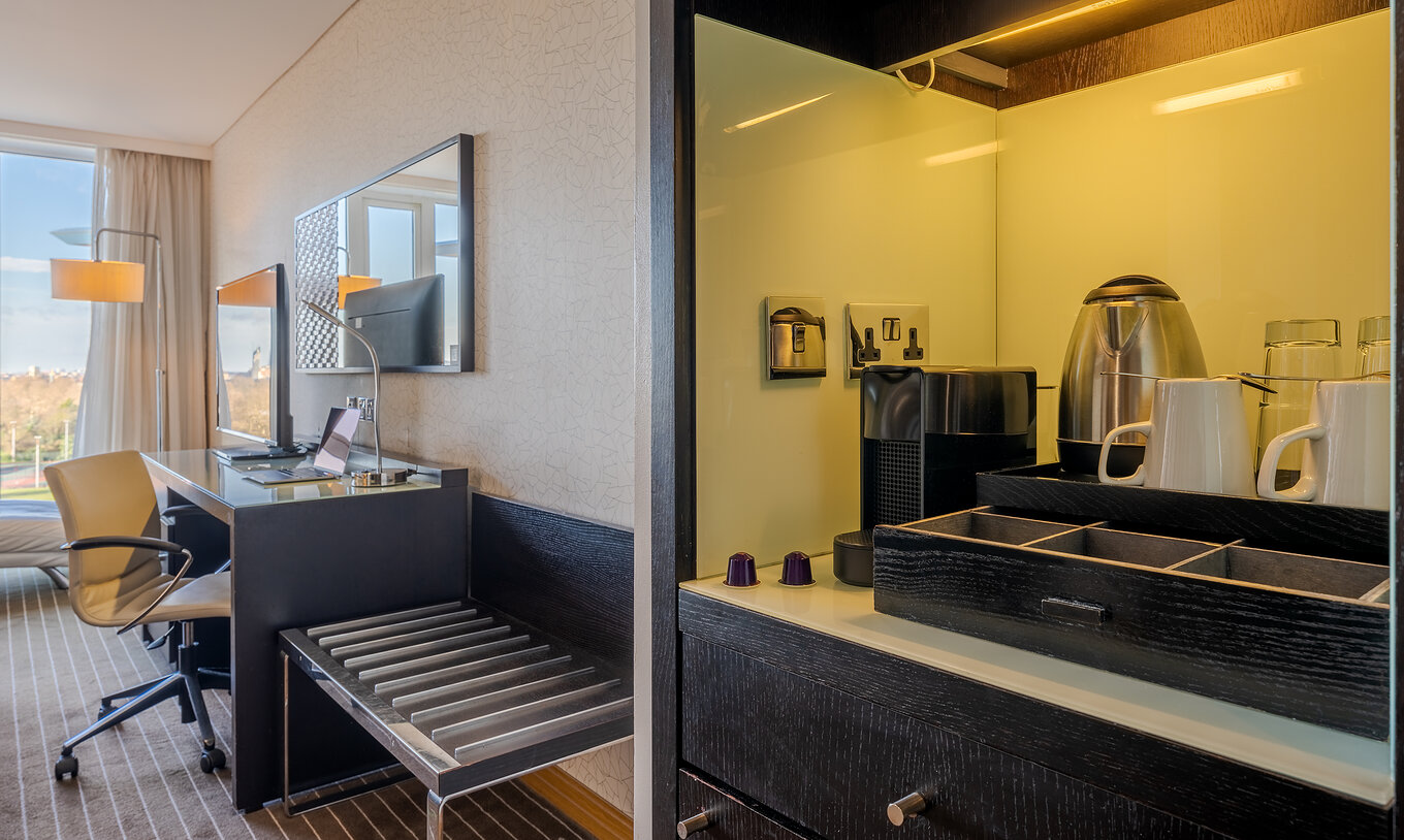 The Premium Twin at Pestana Chelsea Bridge has coffee and tea station, desk with TV and window with view