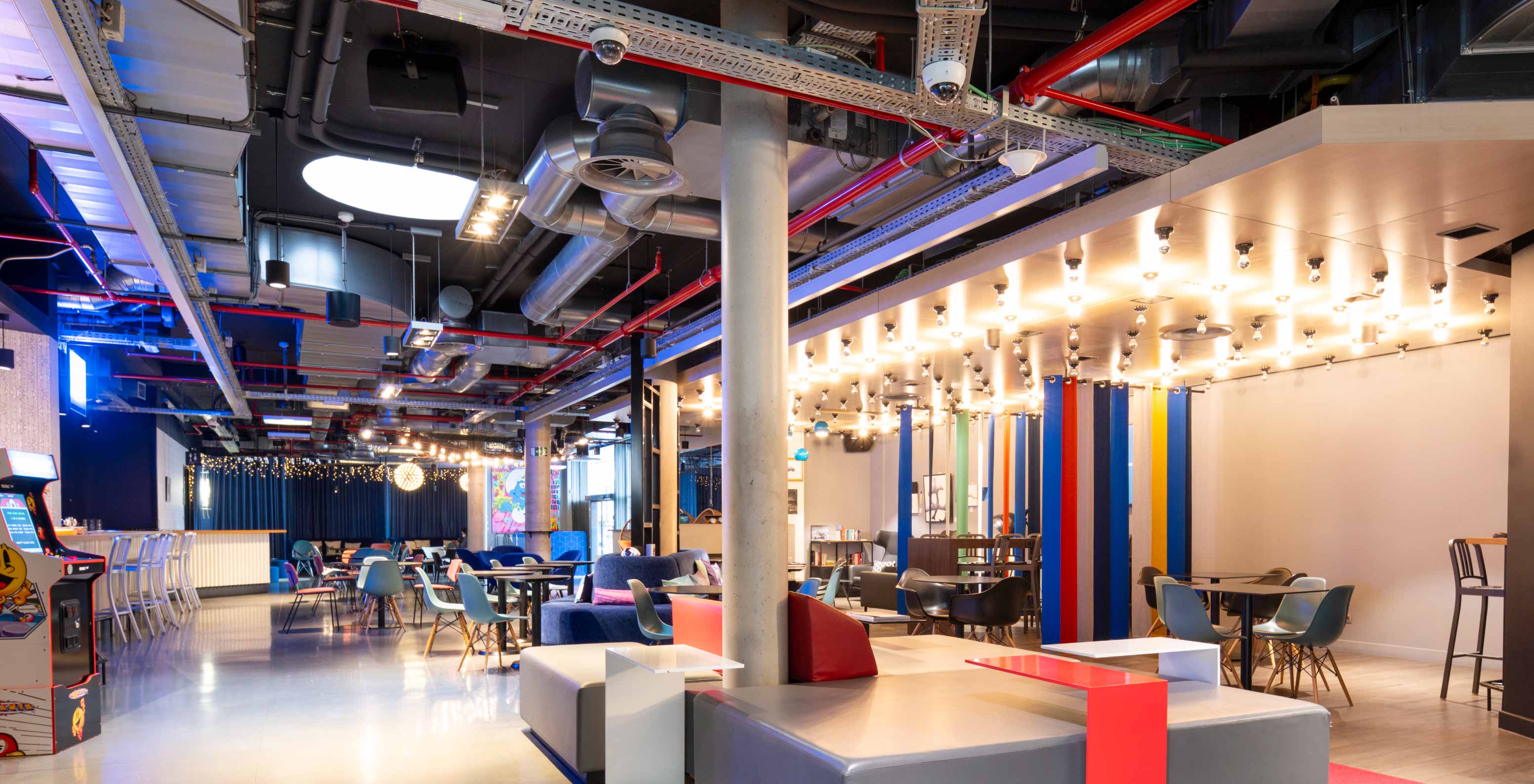 Entrance with sofas and tables at Pestana Brussels Schuman, hotel in Brussels near the European Parliament