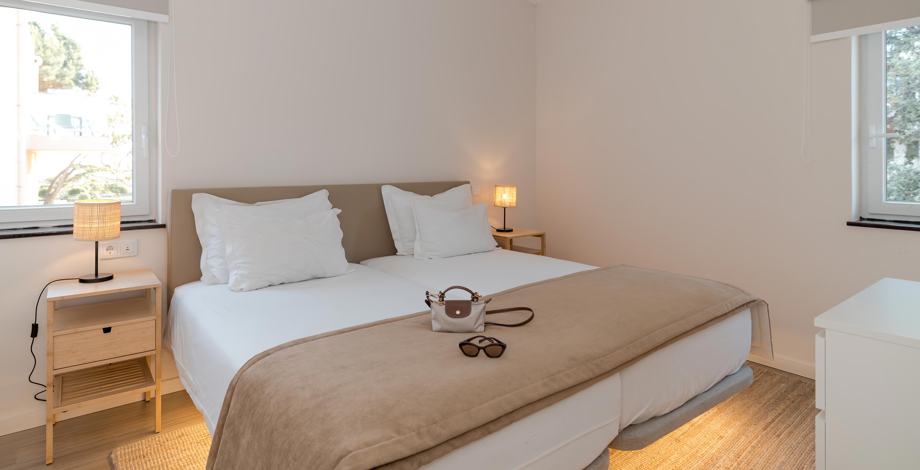 Villa 2 Bedrooms Garden View at Pestana Alvor Beach Villas has a bedroom with two beds, two windows and air conditioning