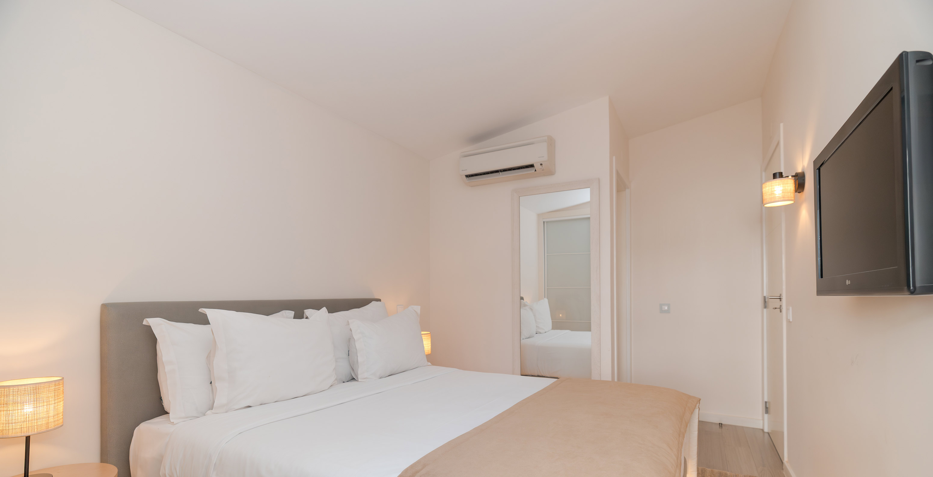 Villa 2 Bedrooms Superior Garden View at Pestana Alvor Beach Villas has a bedroom with double bed and TV