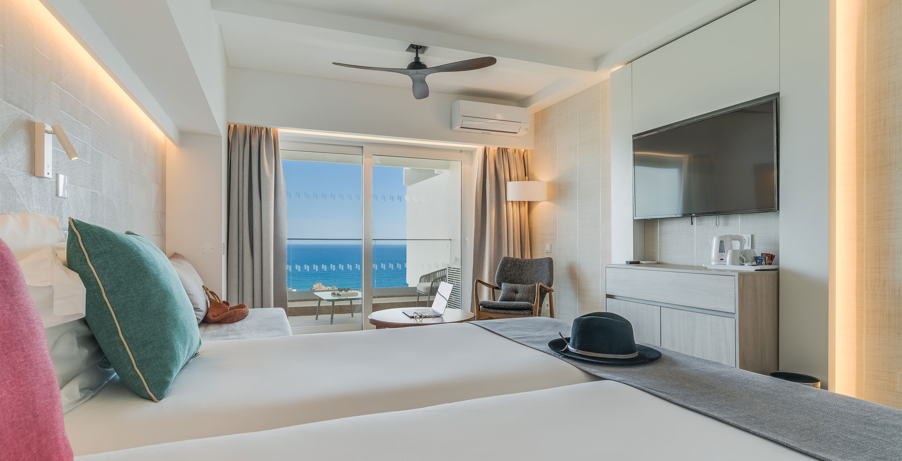 The Classic Sea View Room at Pestana Blue Alvor Beach has two beds, a TV at the end of the bed, and air conditioning