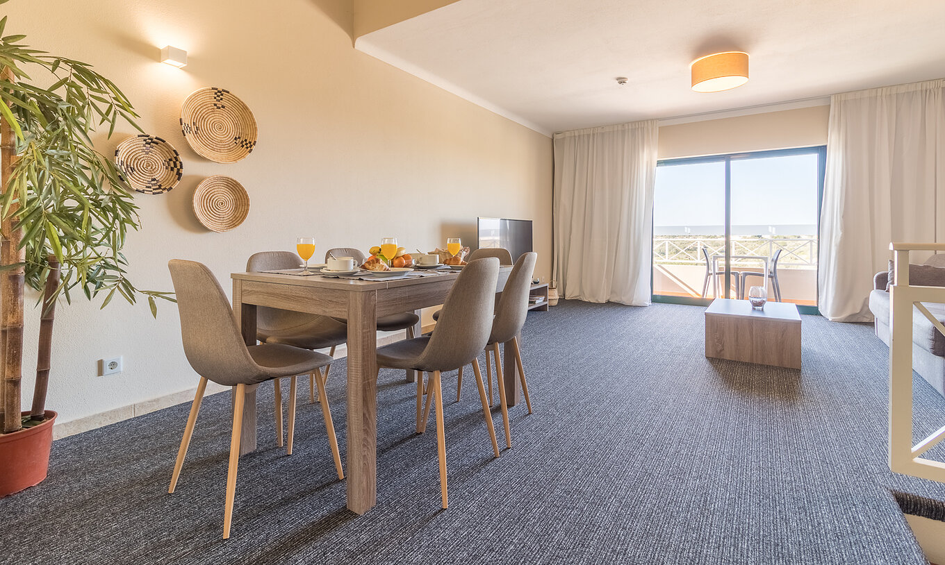 The one-bedroom apartment at Pestana Gramacho has a dining room with balcony and plenty of natural light