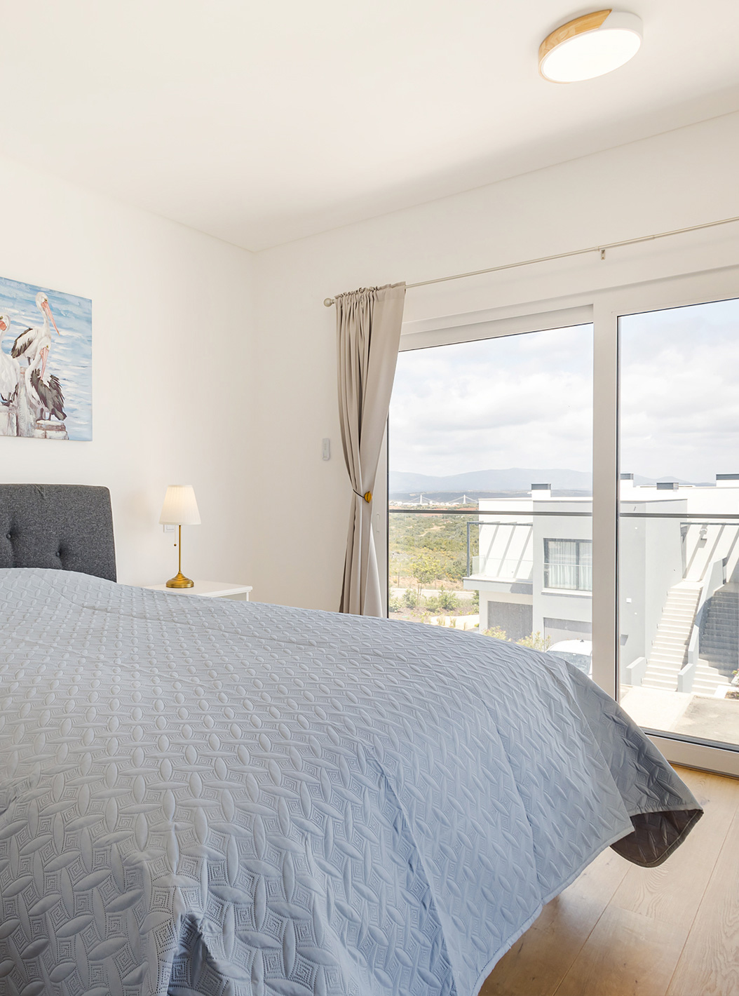 The Ground Floor 1 Bedroom Apartment at Pestana Valley Nature Village has a bed and curtains in shades of grey