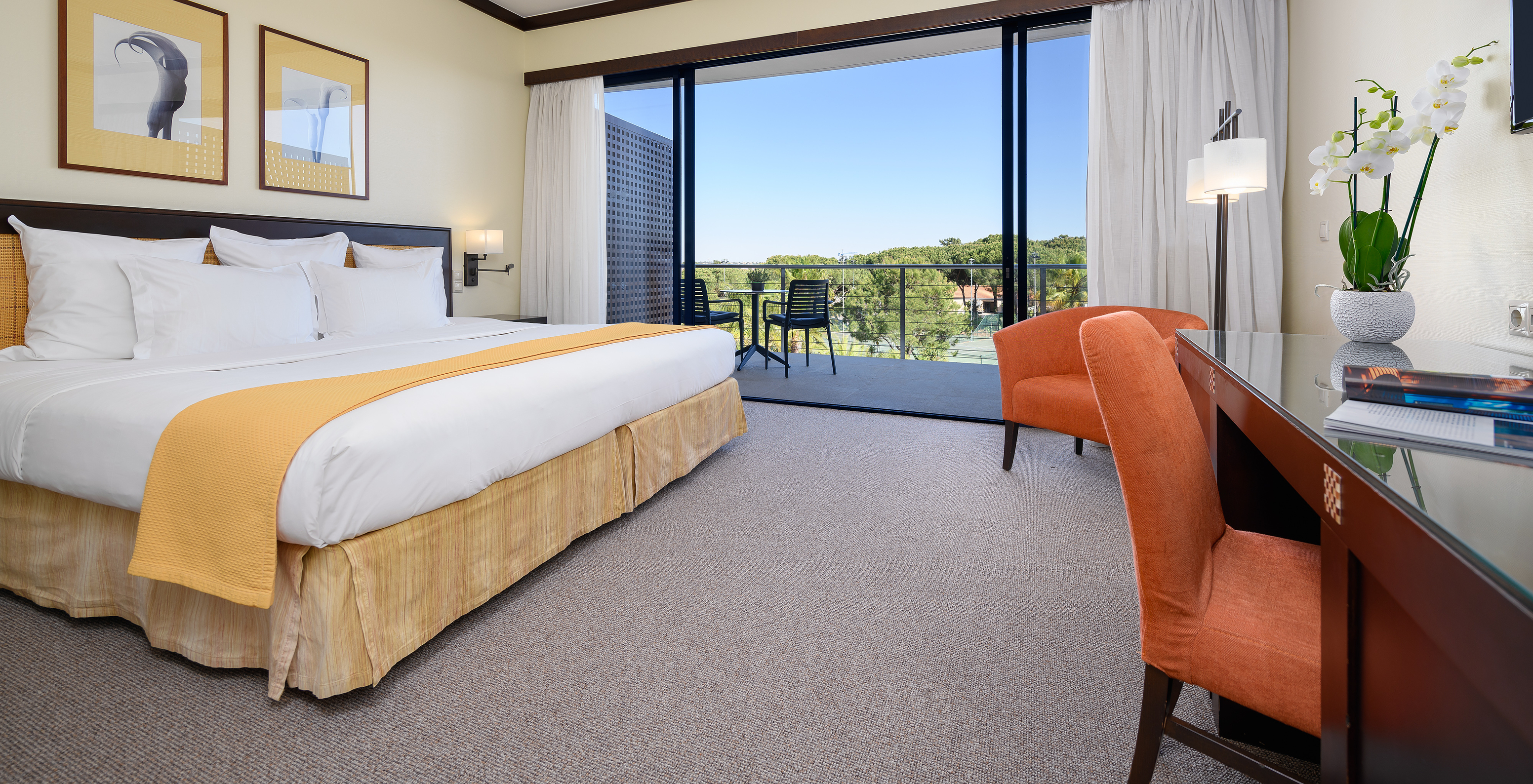 The Superior at Pestana Vila Sol - Vilamoura has a double bed, desk, armchair, and a balcony with chairs