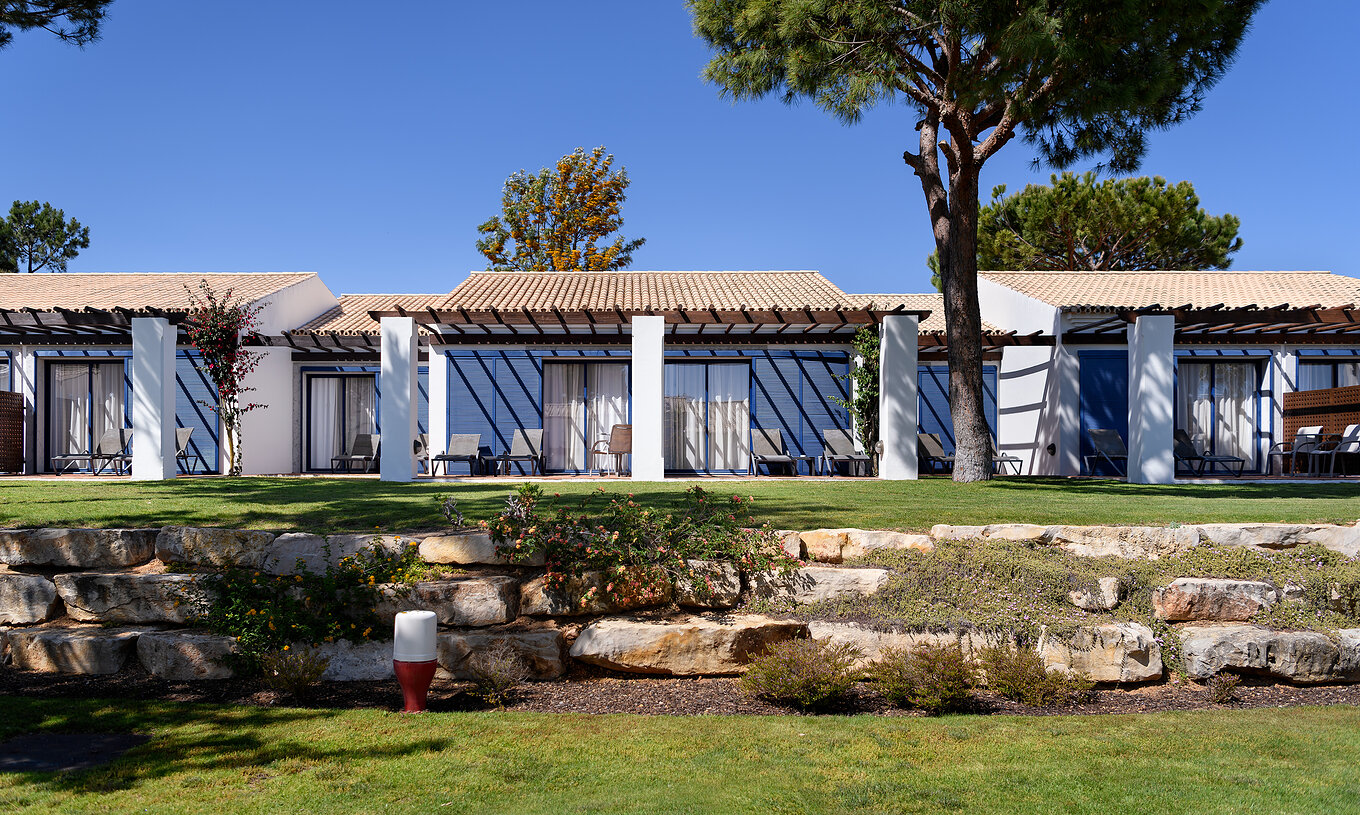 The Suite Garden View at Pestana Vila Sol - Vilamoura has a balcony with sun loungers and direct access to the garden