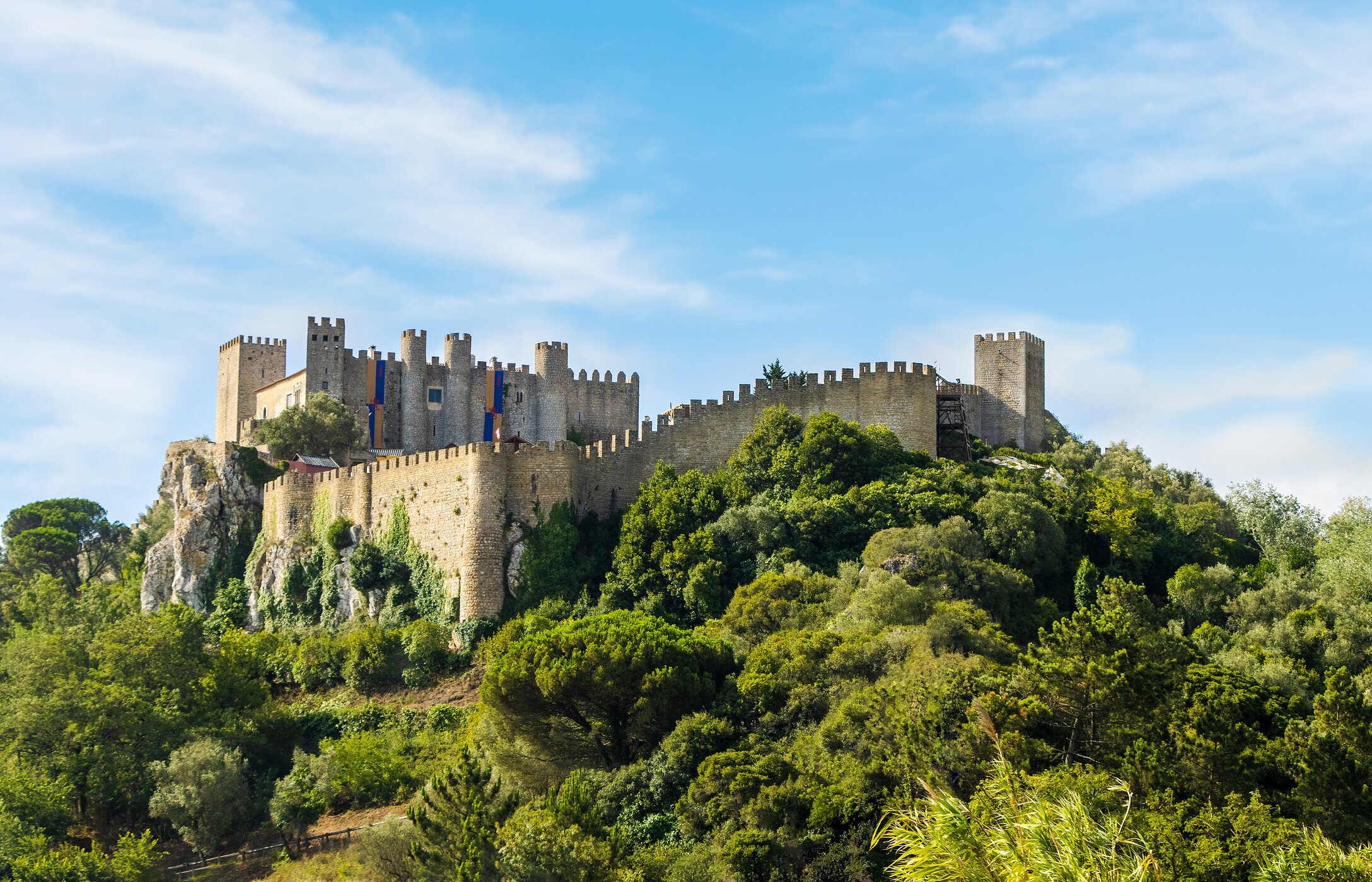 The Castle of Óbidos, with its imposing walls, holds medieval stories and offers stunning views of the village