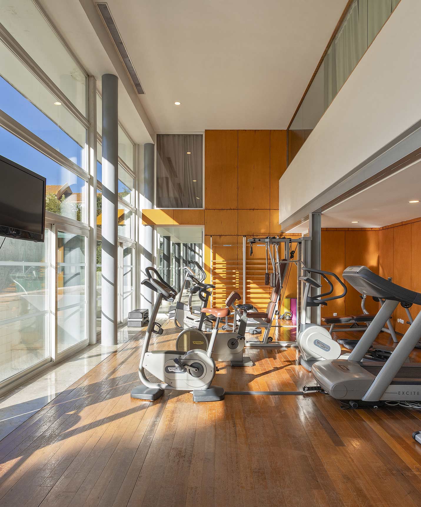 The gym at Pestana Palace Lisboa has various workout machines, including treadmills, bikes, and strength training equipment
