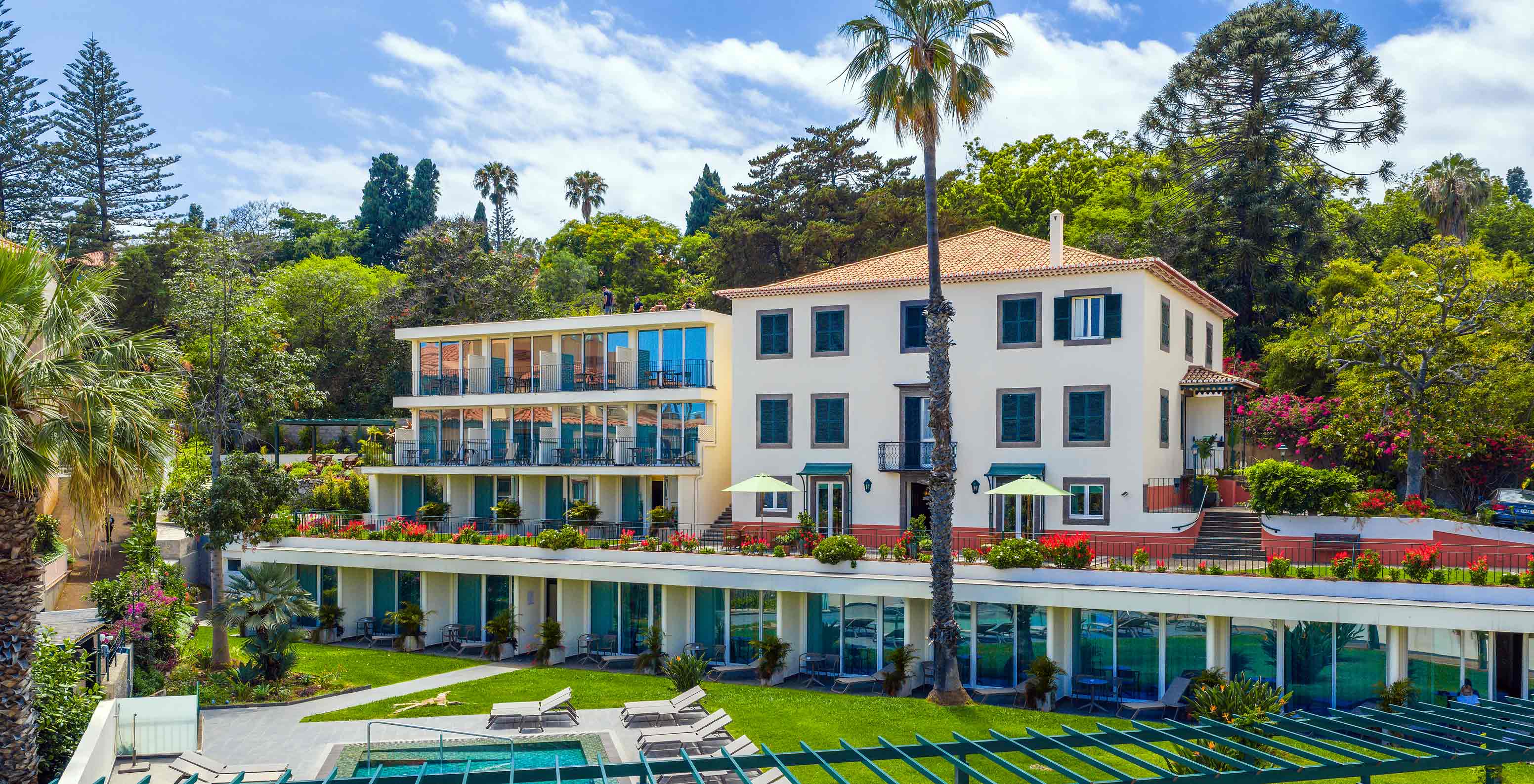 Pestana Quinta Perestrello building, a charming hotel near Funchal, with a swimming pool and garden in front