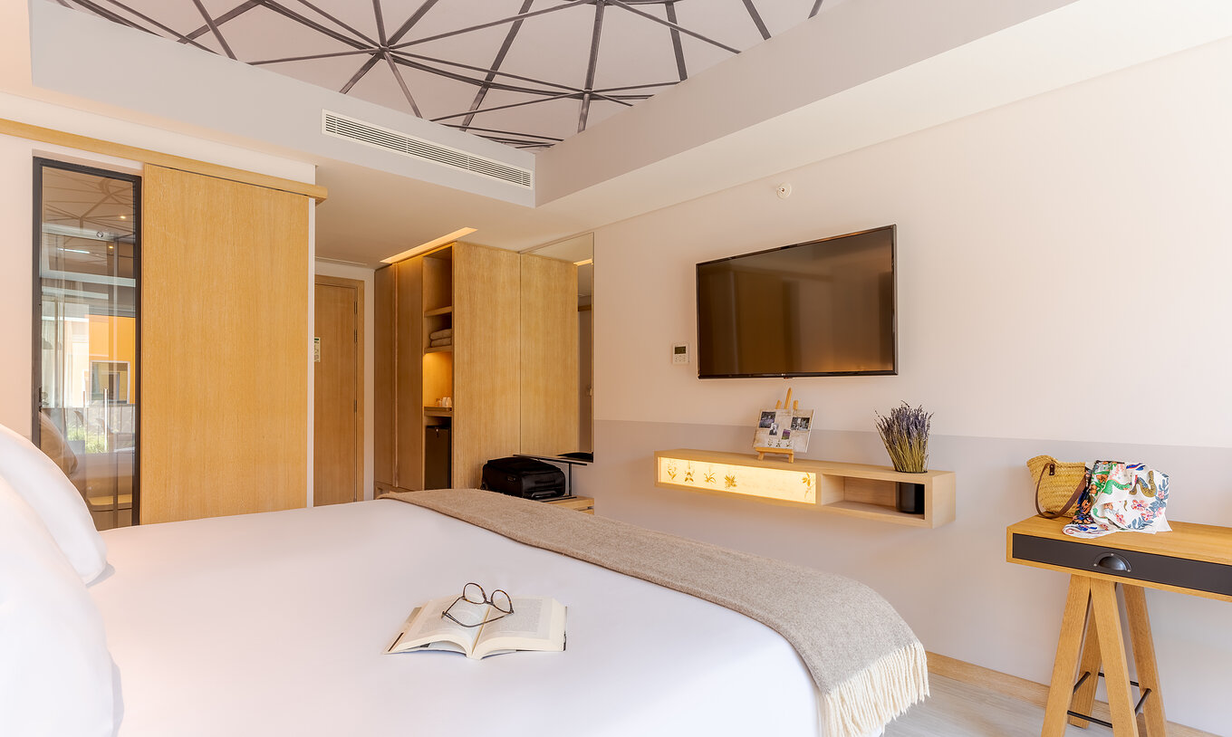 The Superior Family room at Pestana Douro Riverside includes a double bed, television, and wardrobe for clothes