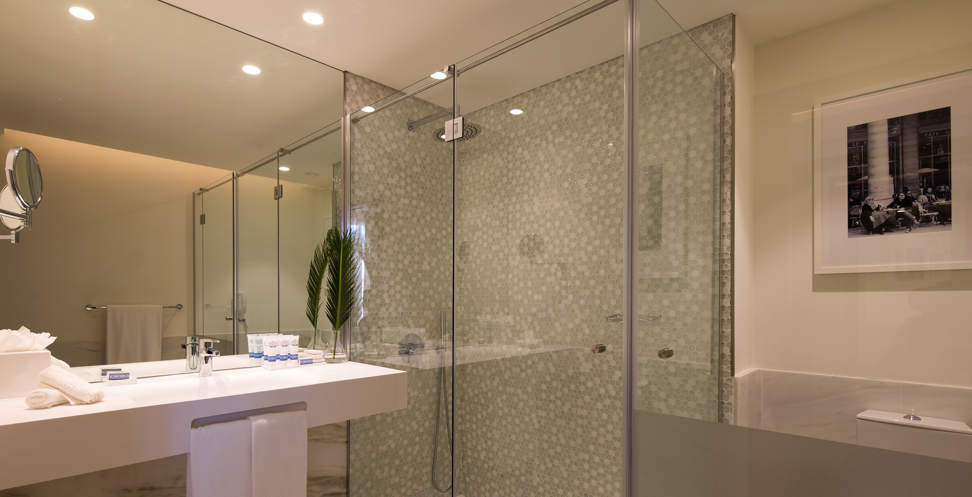 The Master Suite do Pestana Porto - A Brasileira has a bathroom with shower stall with shower and a large sink
