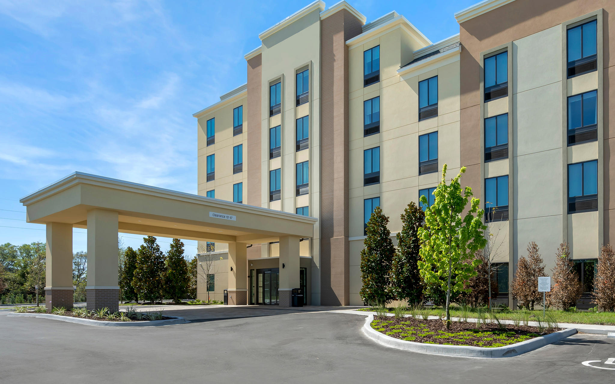 View of the façade of Pestana Orlando, on a clear blue sky day with few clouds