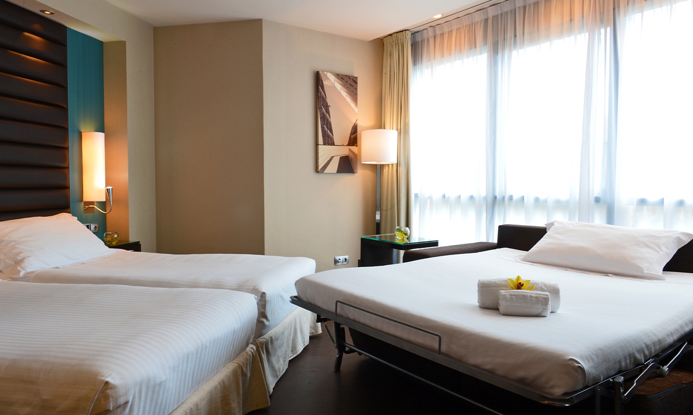 El Superior Familiar del Pestana Arena Barcelona tiene posibilidad de tener tres camas, siendo la tercera un sofá-cama