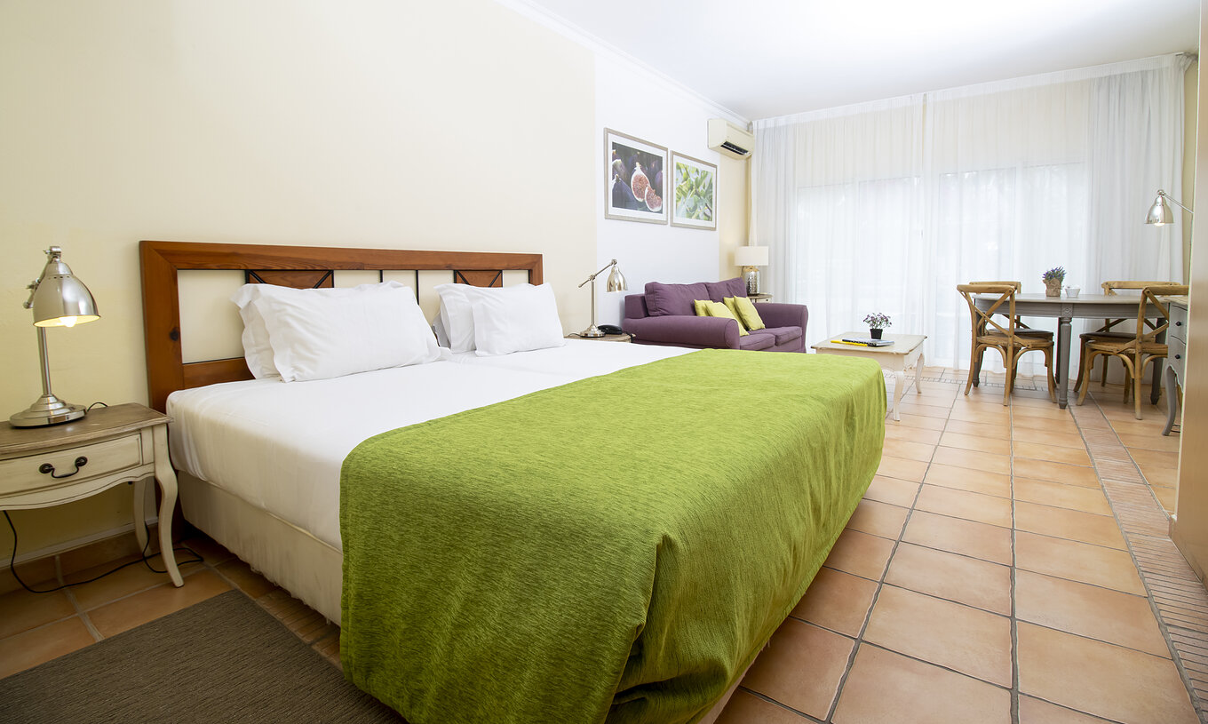 Het Studio van Pestana Palm Gardens heeft een kitchenette met een fornuis, een wasmachine en afwasmachine