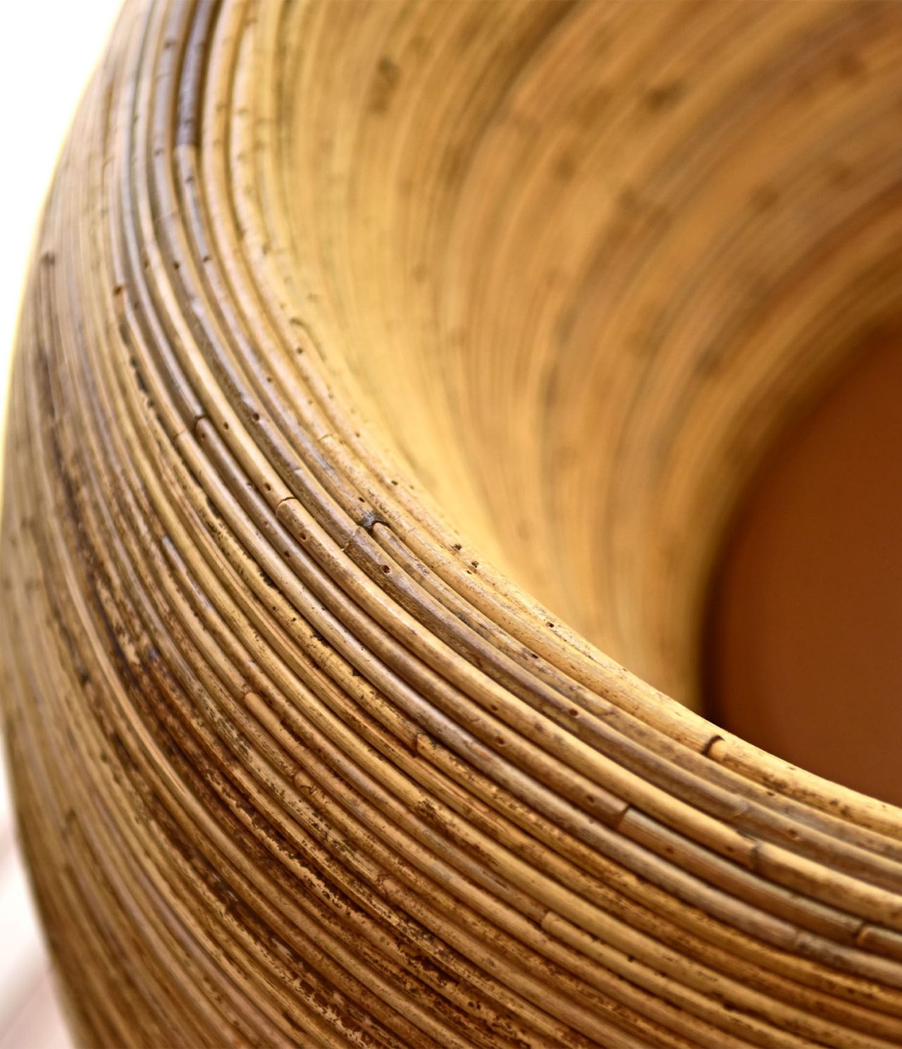 A Adega Bar has neutral-colored rattan chairs for a relaxing vibe