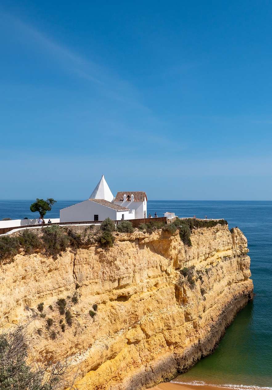 Chapel of Nossa Senhora da Rocha a white sanctuary atop a cliff overlooking the Atlantic Ocean