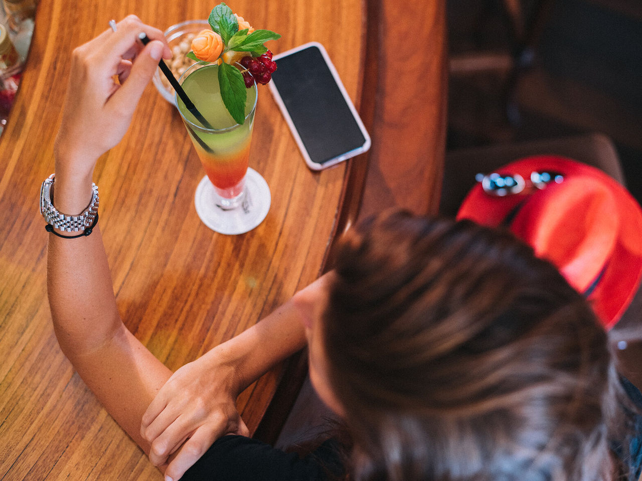 The Vila Lido Bar, at the Hotel with Sea Access in Funchal, offers a colorful cocktail decorated with fruit and mint