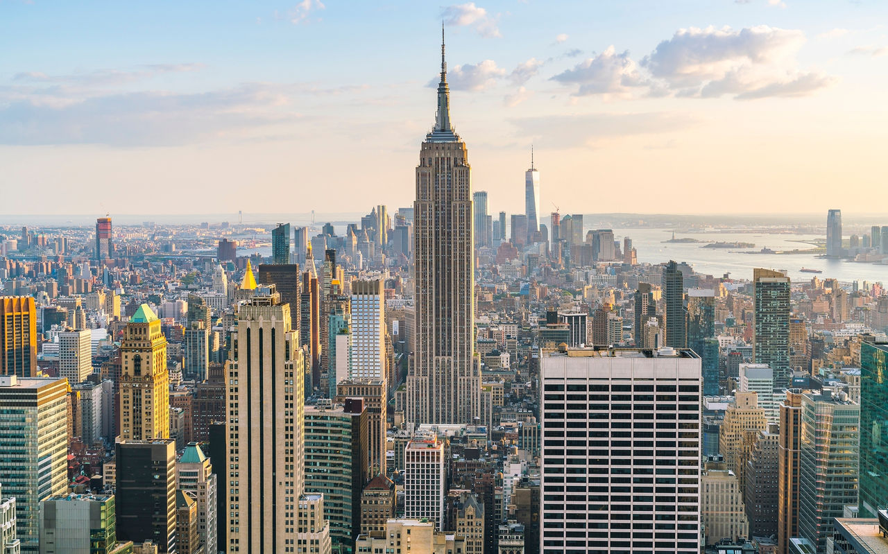 New York skyline with the Empire State Building in the foreground, surrounded by skyscrapers in downtown Manhattan